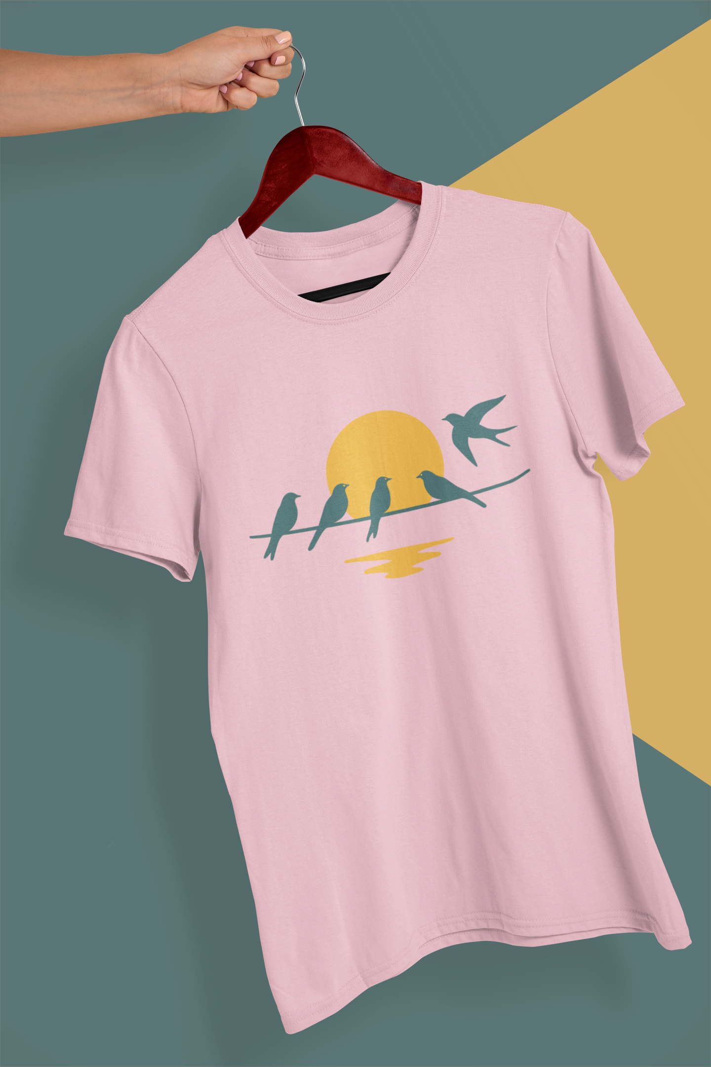 Organic cotton t-shirt with flying swallows at sunset.