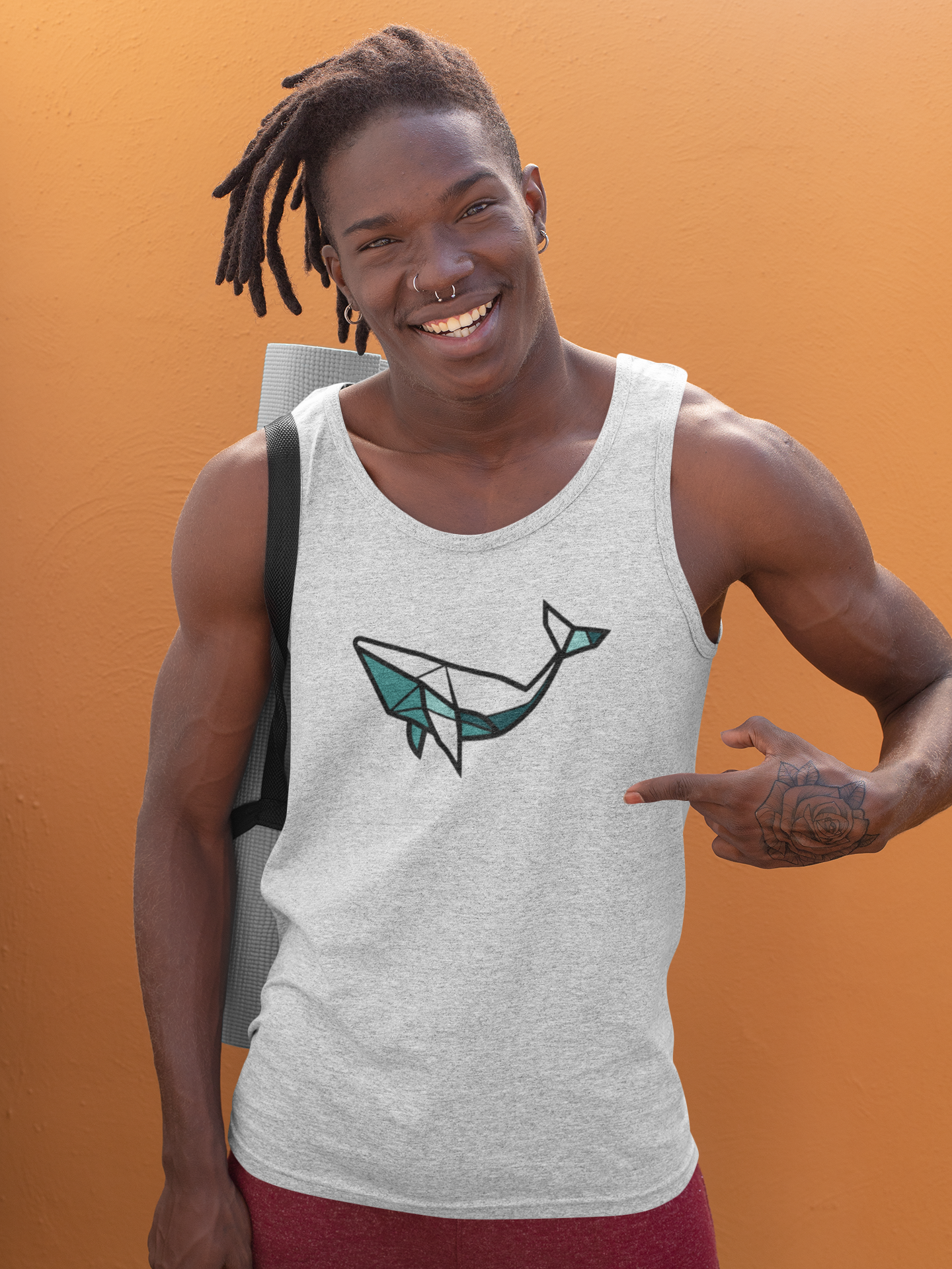 Close-up of the minimal whale logo on soft organic cotton.