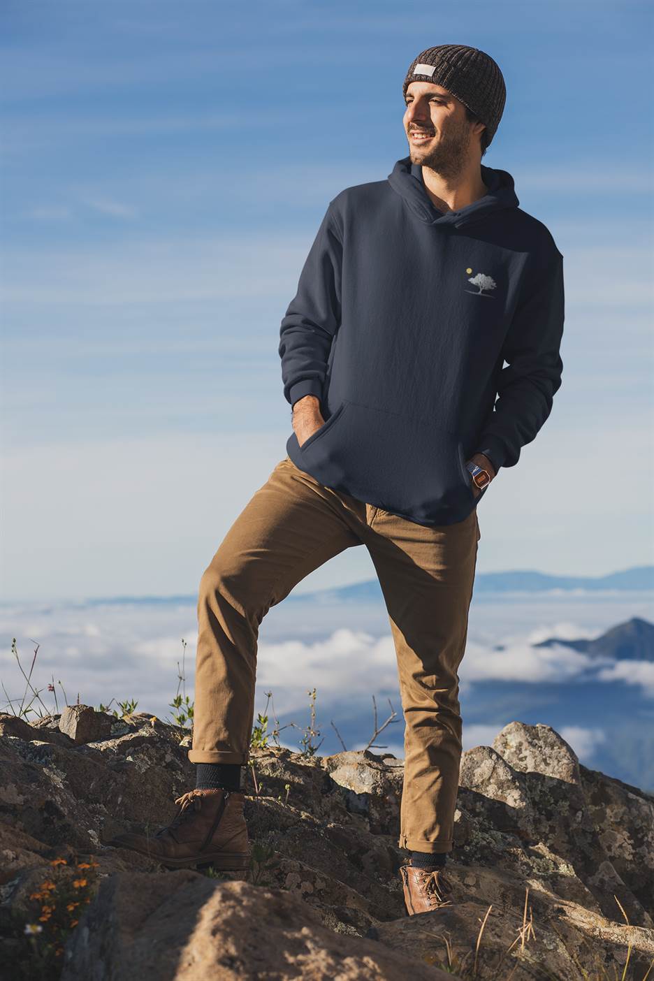 Dark blue Evora Sunset Minimal Organic Hoodie worn outdoors, showcasing its sustainable and stylish design. Perfect for adventure and casual wear.