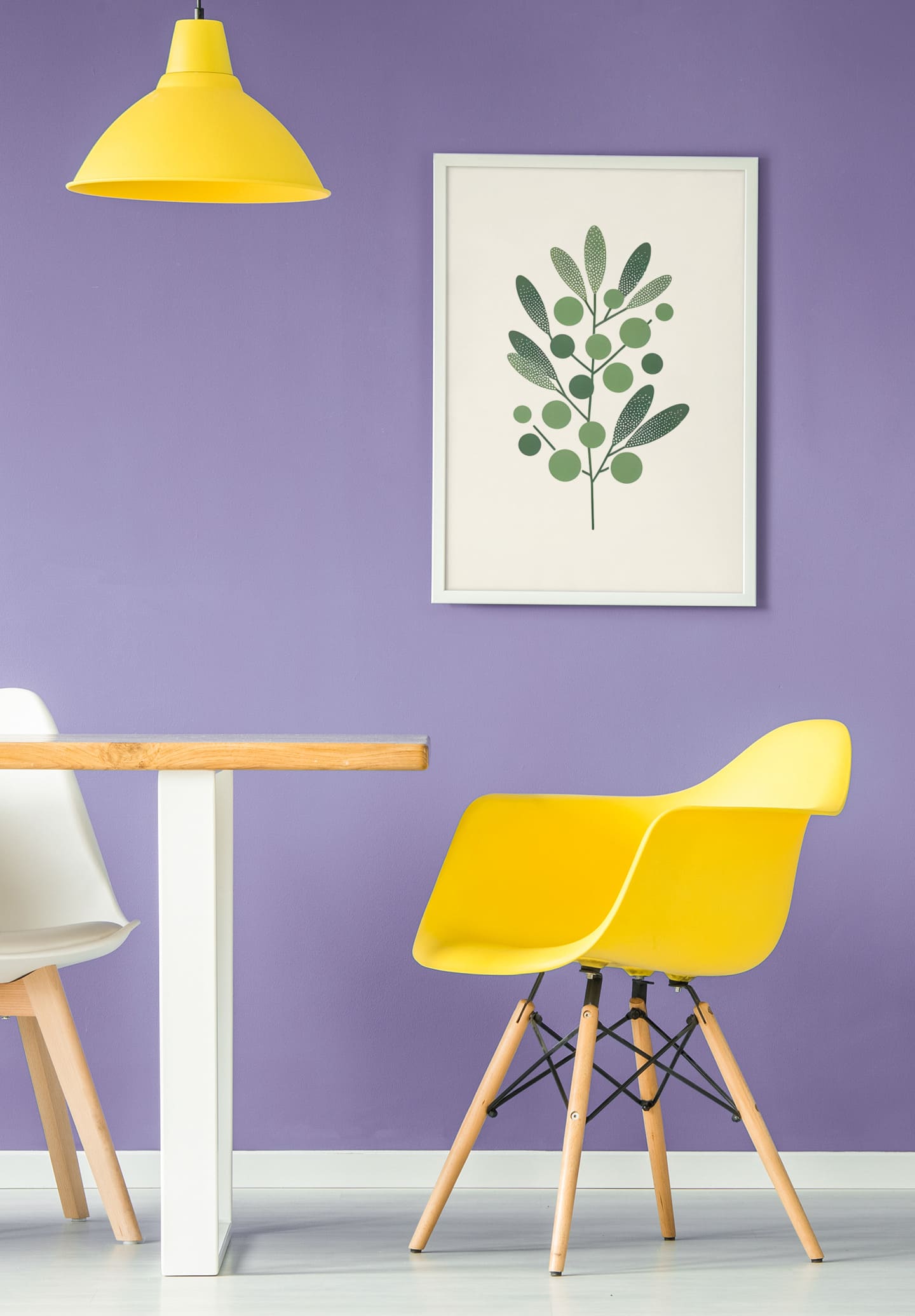 Framed Olive Branch Minimalist Poster on a vibrant purple wall, complementing a modern dining space with yellow and white chairs. A bold decor choice.