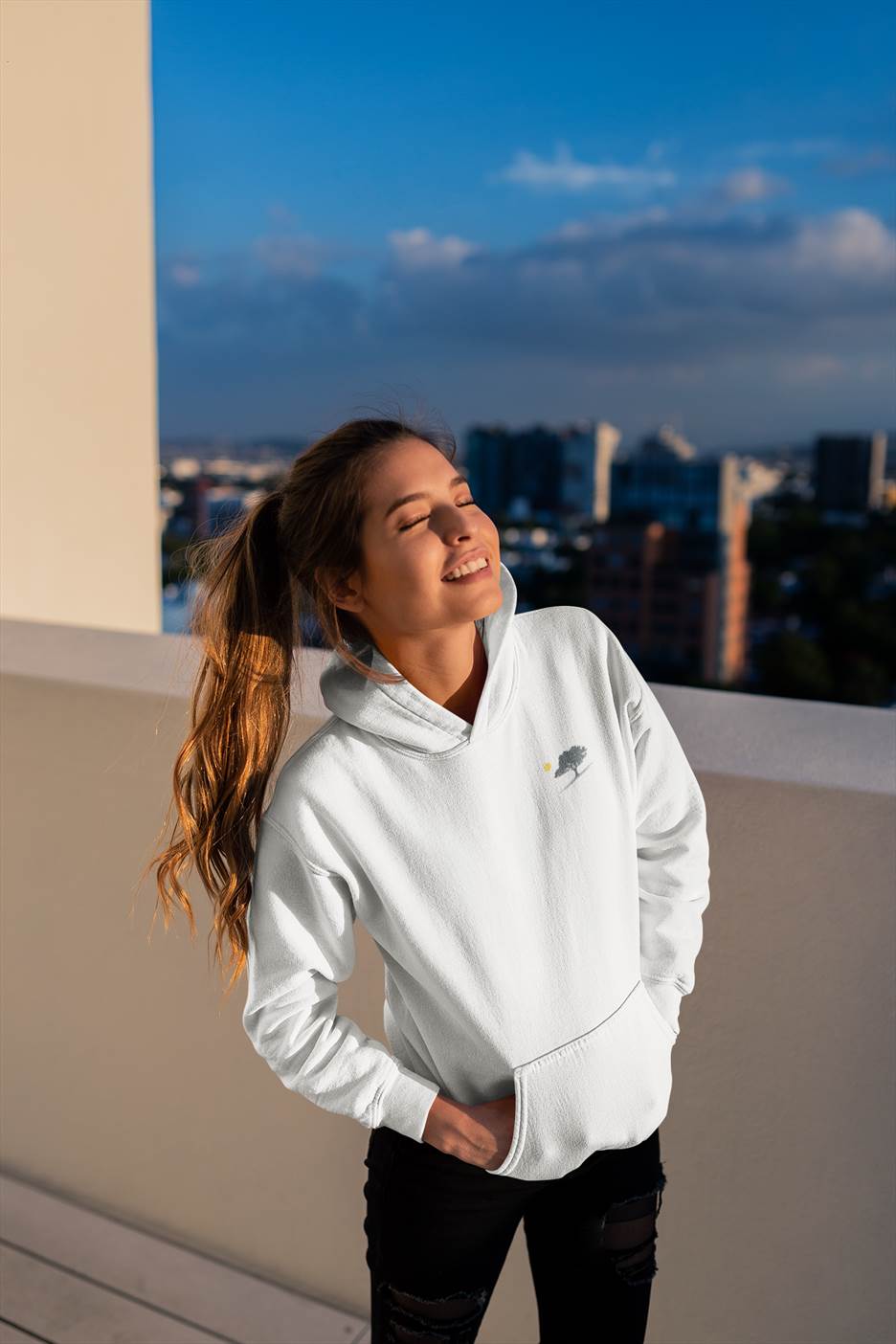 White Evora Sunset Minimal Organic Hoodie with a minimalist oak tree design. Comfortable, ethical, and inspired by the serene landscapes of Portugal.