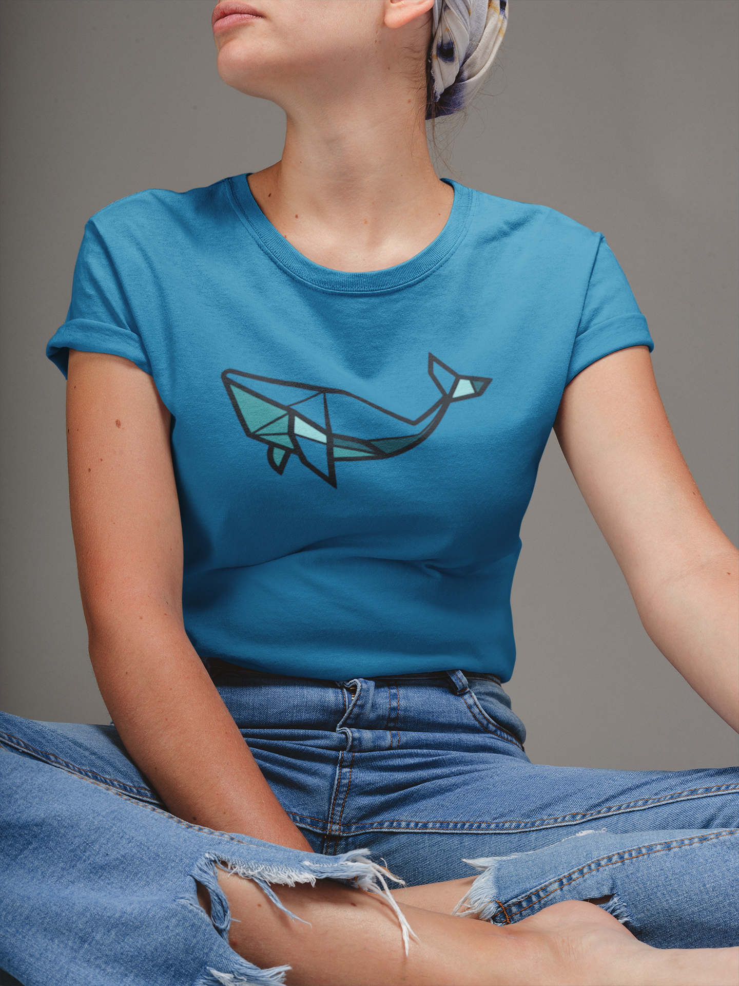 Flatlay of organic cotton whale shirt, large front graphic.
