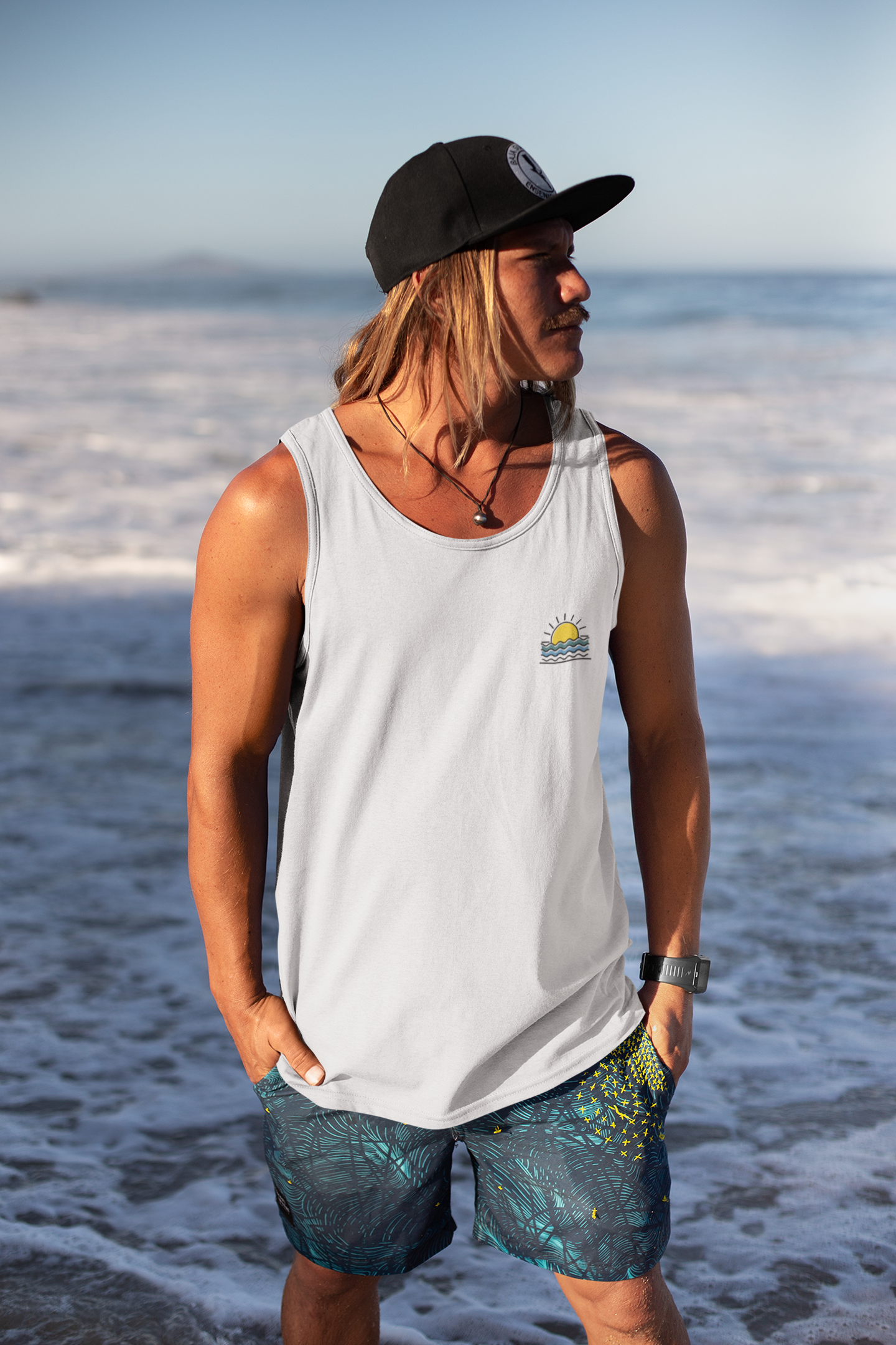 Model wearing the Minimal Sunset Tank Top for Men, part of the Nazaré Collection.