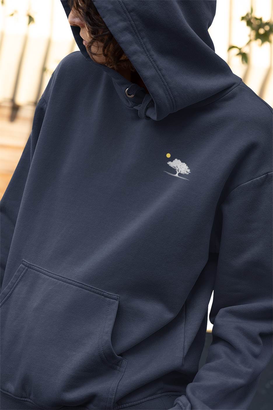 Navy blue Evora Sunset Minimal Organic Hoodie with a subtle oak tree embroidery. Sustainable, unisex, and ideal for eco-conscious fashion enthusiasts.
