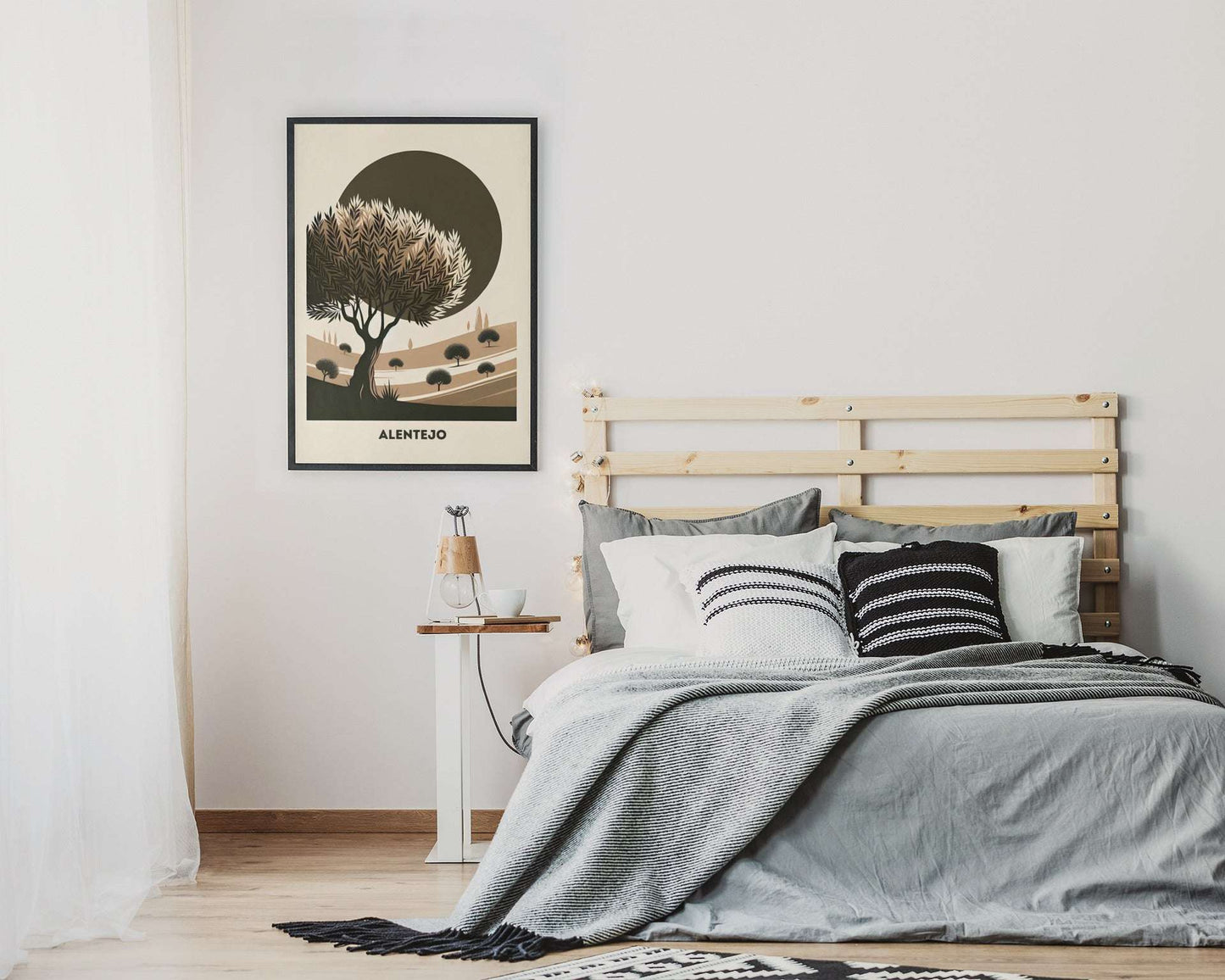 Alentejo Cork Tree Printed Poster in a black frame hanging above a bed. A serene and minimalist decor piece for bedroom interiors.