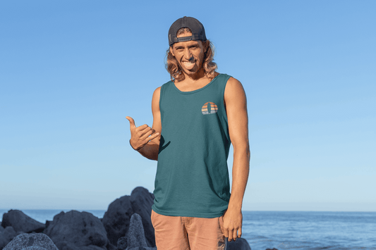 Nazaré Surf Minimal retro unisex tank top in teal, featuring a vintage surf logo. Organic cotton tank perfect for beach and surf culture lovers.
