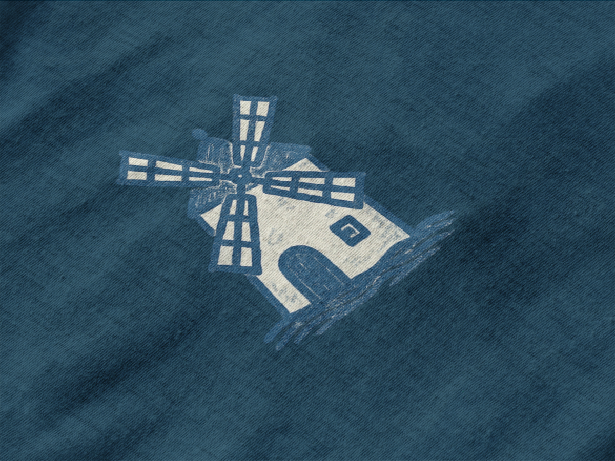 Eco-conscious shirt with subtle windmill print.