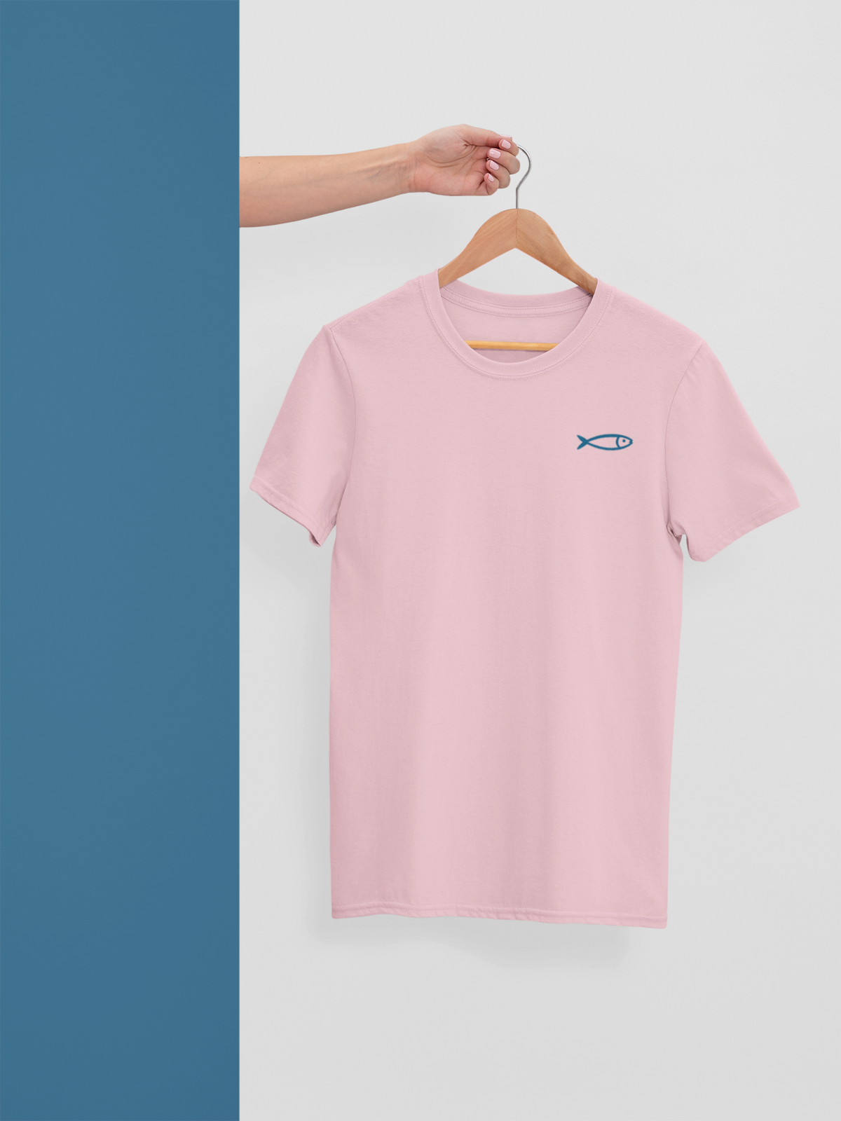 Light pink organic cotton crew neck t-shirt with small minimalist fish graphic, sustainable Portugal gift.