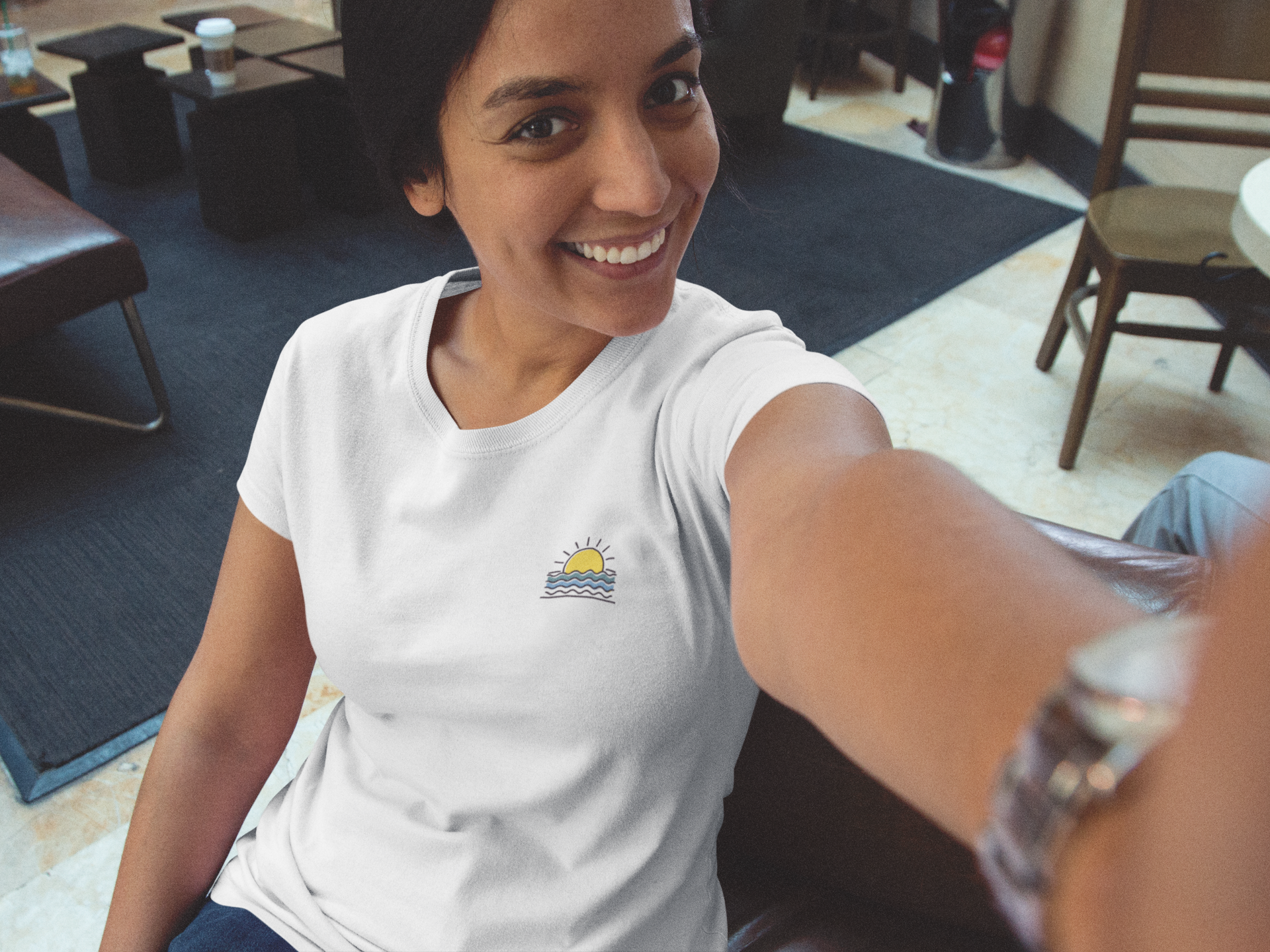 Model wearing the Sunset Over the Atlantic T-Shirt, perfect for ocean lovers.