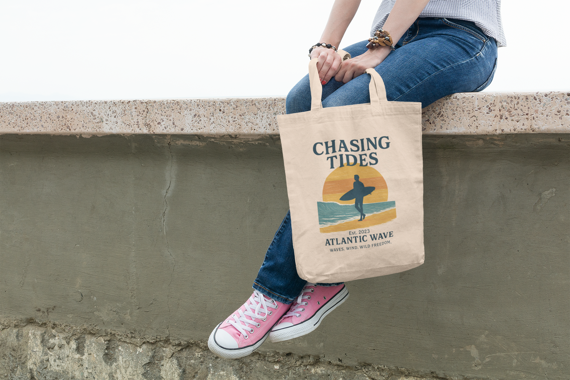 Model holding surf tote bag on the beach, casual and stylish.