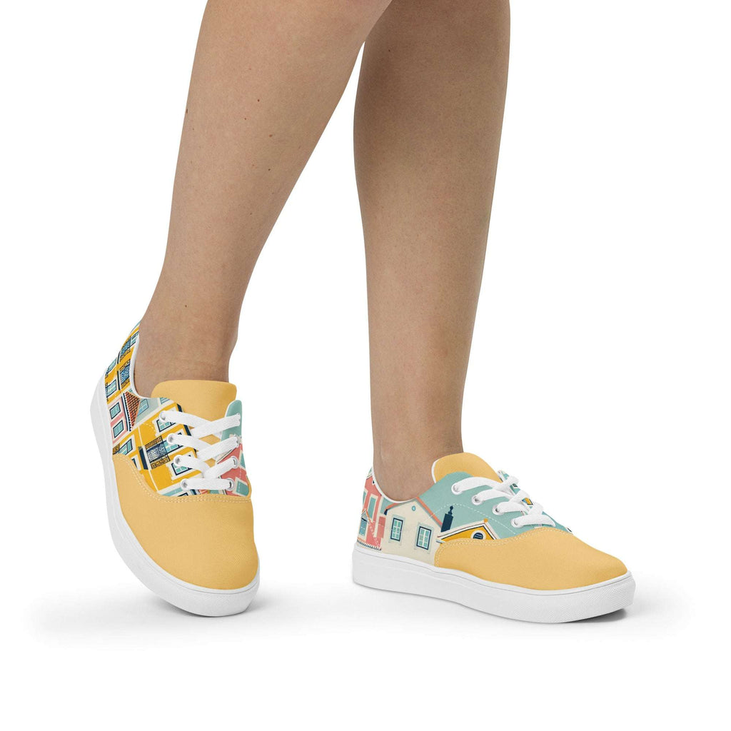 A person wearing Lisbon's Alfama Sneakers, showcasing the vibrant yellow and pastel house design. Comfortable and stylish footwear for any occasion.