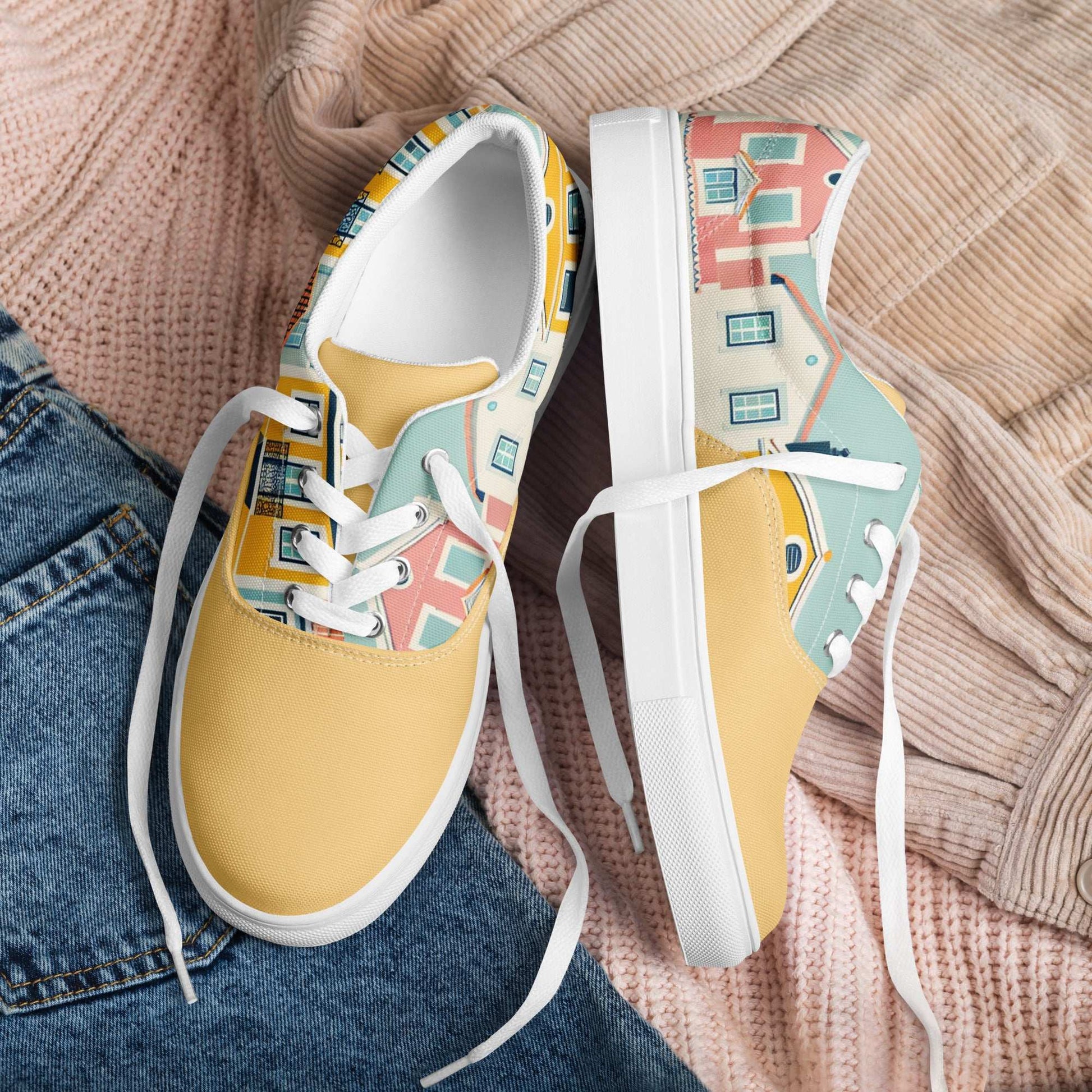 Unisex Alfama Sneakers with Lisbon-inspired yellow house patterns, displayed on a cozy outfit setting. Comfortable and stylish footwear for any occasion.