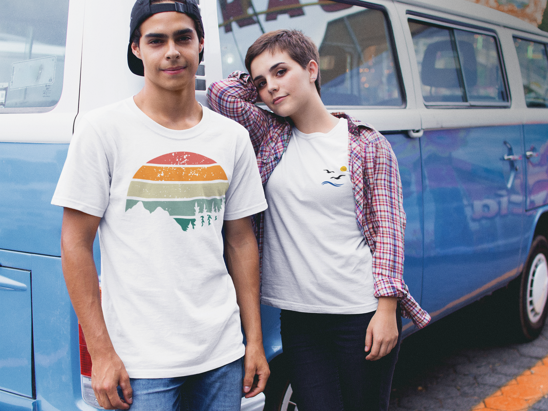 Young couple in white Madeira Mountains Retro Organic Vintage T-Shirts standing by a vintage van. A perfect hiking tee for road trips.