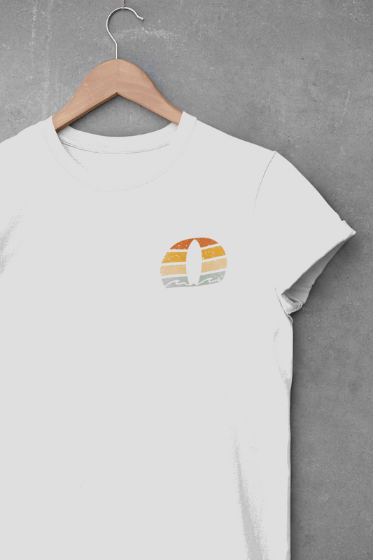 White Nazare Surf Minimal Organic T-shirt with a vintage surf logo, hanging on a wooden hanger against a concrete wall. Made from 100% organic cotton.