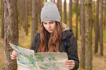 Light gray Lisbon Electrico Beanie with embroidered tram, perfect for outdoor exploration. A warm and stylish unisex turbo acrylic hat.