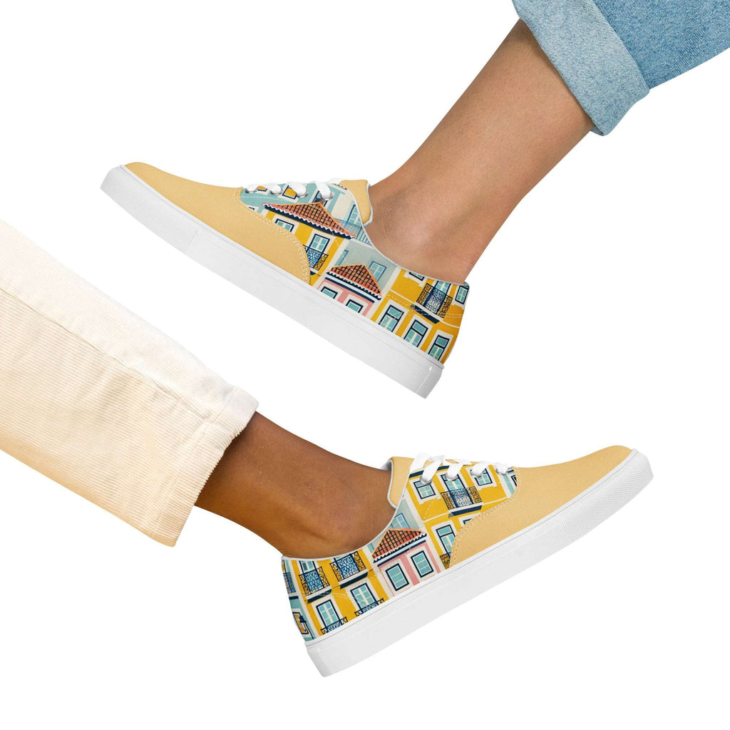 Two people wearing Lisbon's Alfama Sneakers, showcasing the vibrant yellow and pastel house design. A stylish and unisex footwear choice.