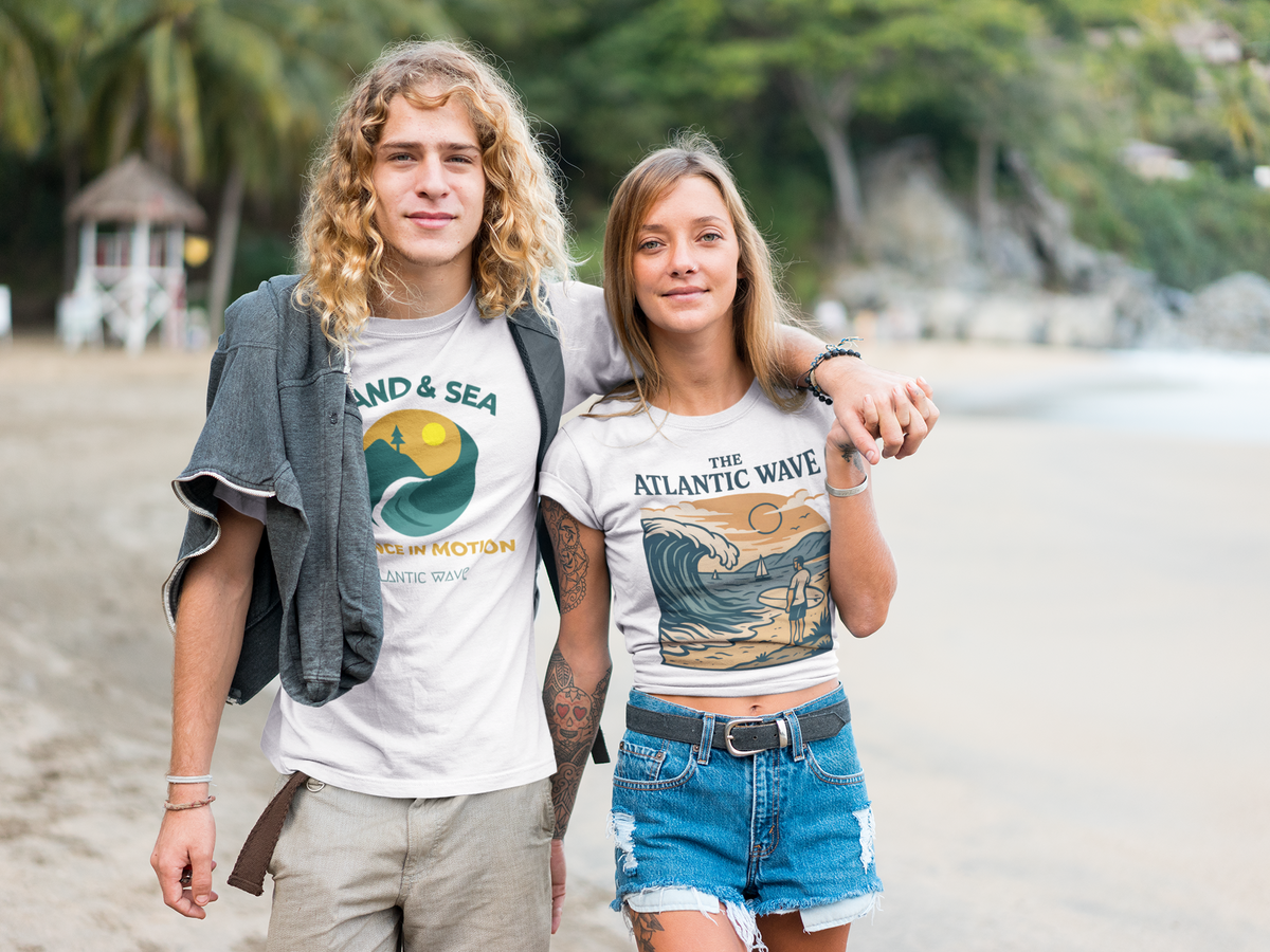 Organic cotton white tee with vintage Portugal surfing graphic, worn by woman at beach.