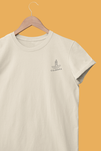 Beige t-shirt with a logo on a hanger against an orange background