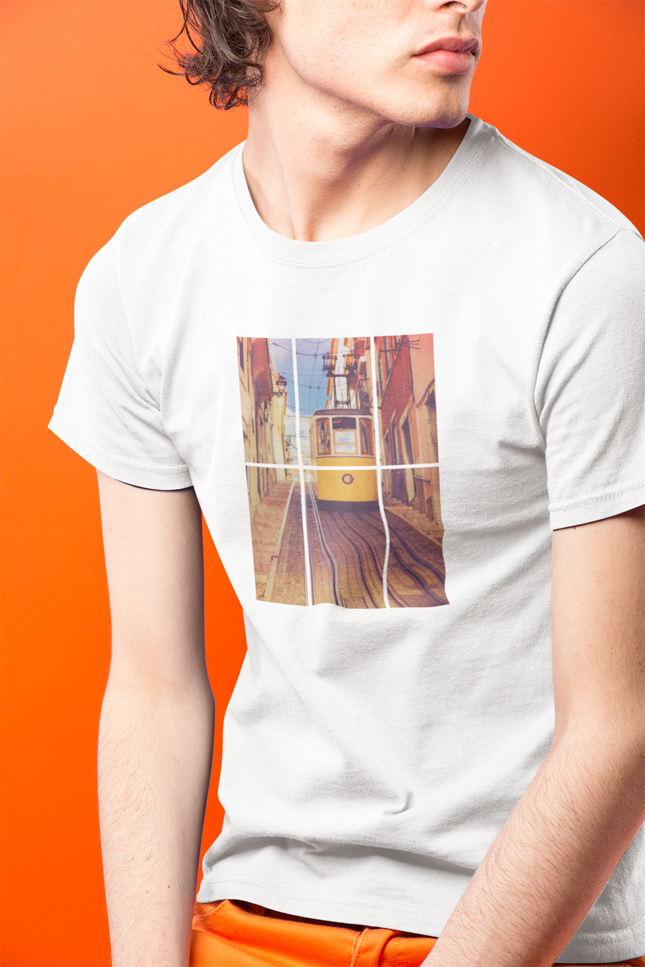 Man in a Lisbon Tram T-shirt with a bold yellow tram print. Crafted from organic and eco-friendly materials for a premium and sustainable fit.