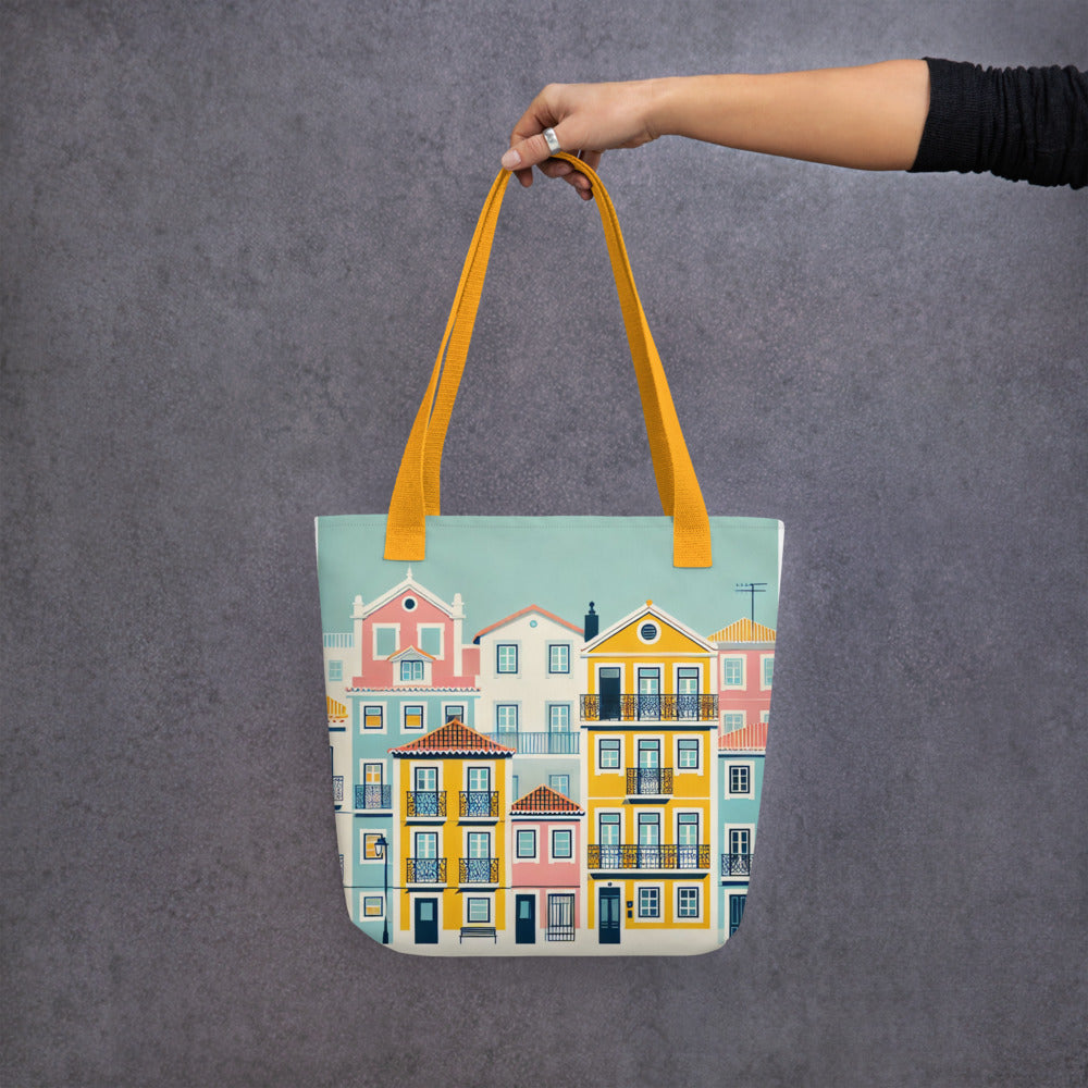 Hand holding the Lisbon Tote Bag from the Alfama Collection against a gray background. Spacious, durable, and perfect for everyday use.