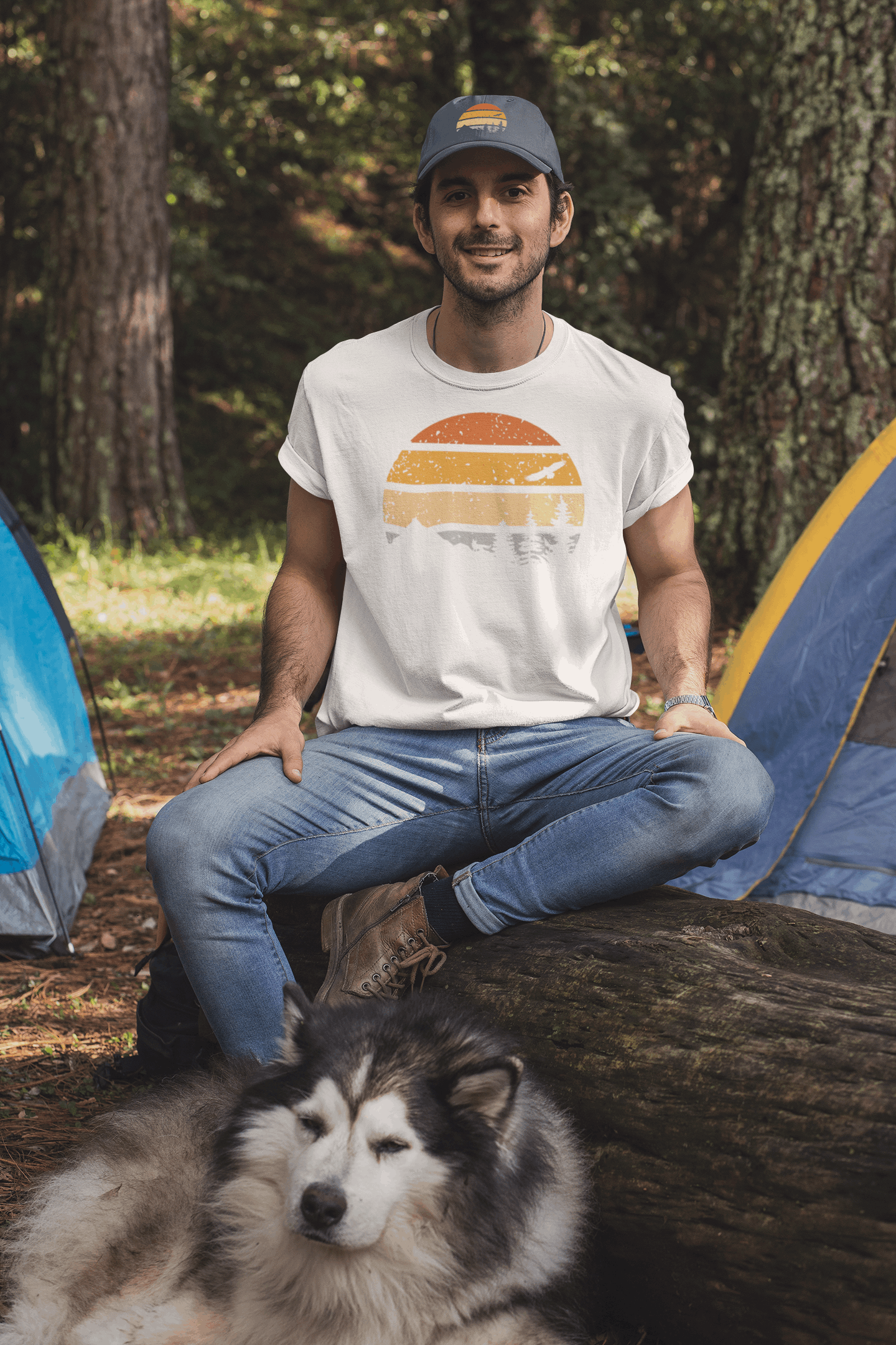 Green Madeira Vintage Cap with a mountain logo, worn by a man camping with a husky. A must-have accessory for outdoor enthusiasts.