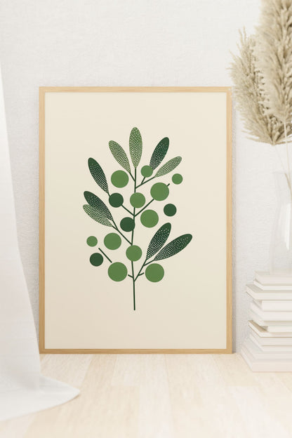 Framed Olive Branch Minimalist Poster resting on a light wooden floor, surrounded by soft decor elements. A serene botanical artwork for home styling.