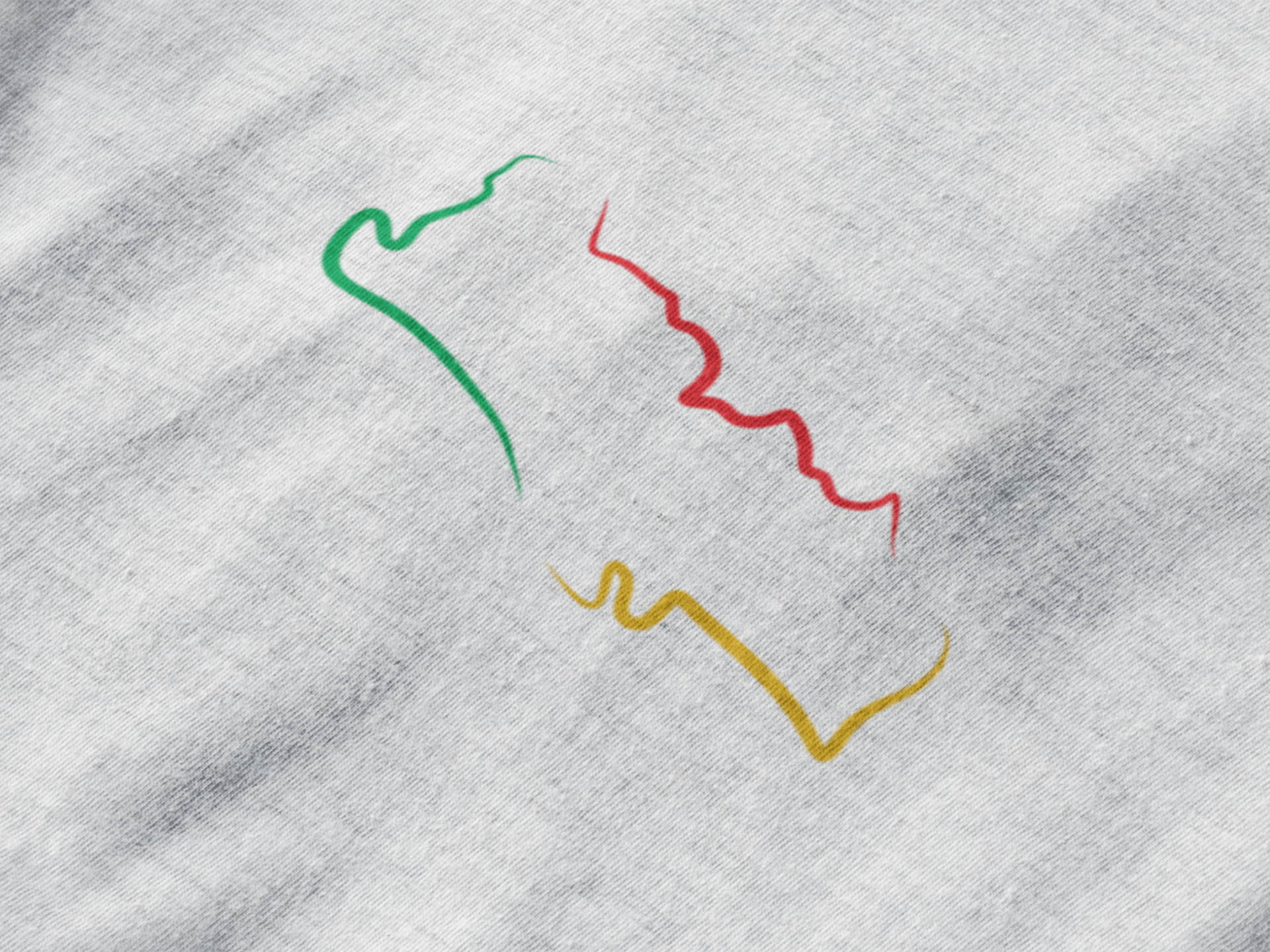Close-up of Portugal T-Shirt featuring a minimalist embroidered map design in green, red, and yellow on organic cotton fabric.