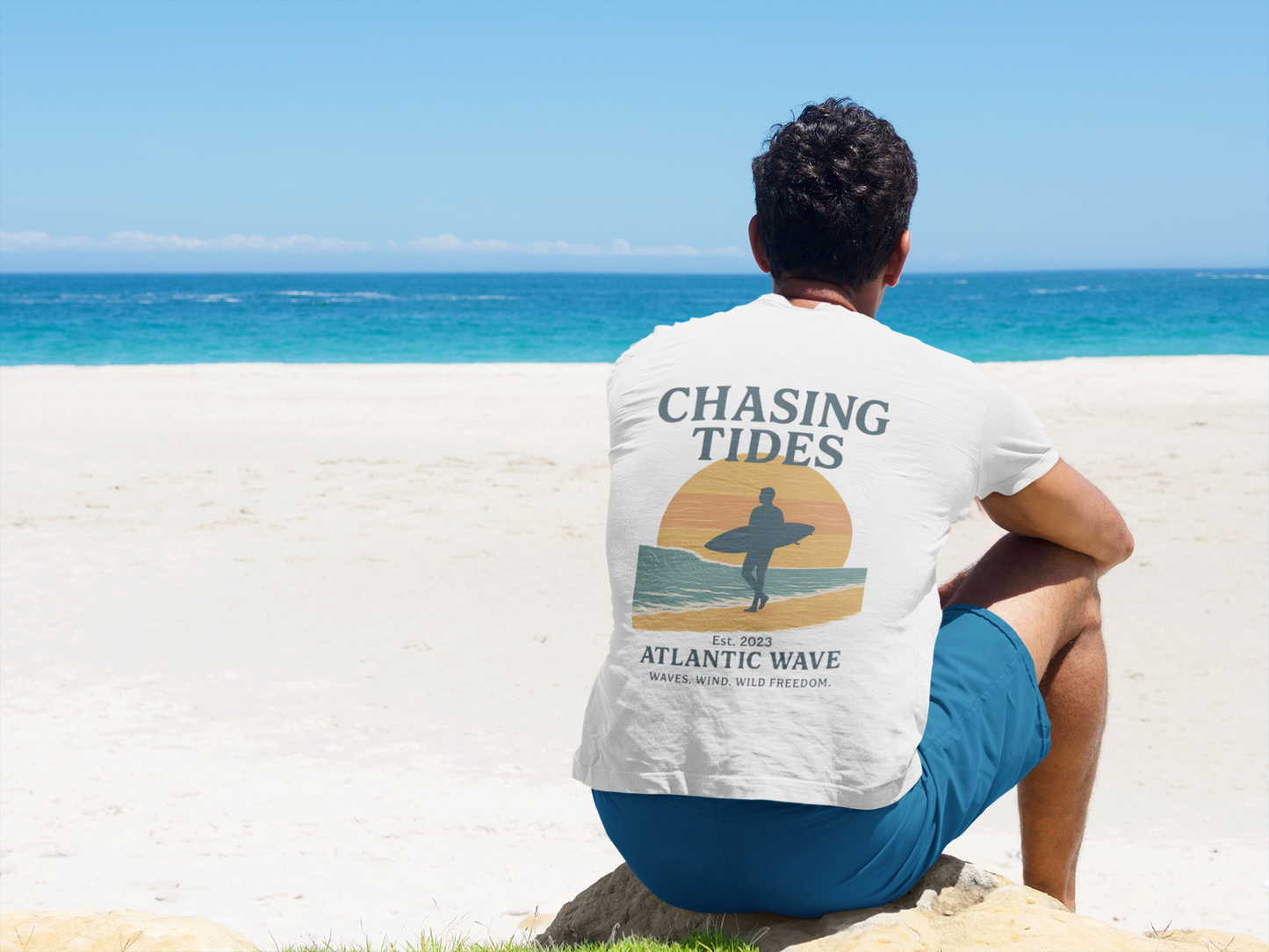 Close-up of the Ride the Waves surf logo printed on organic cotton.