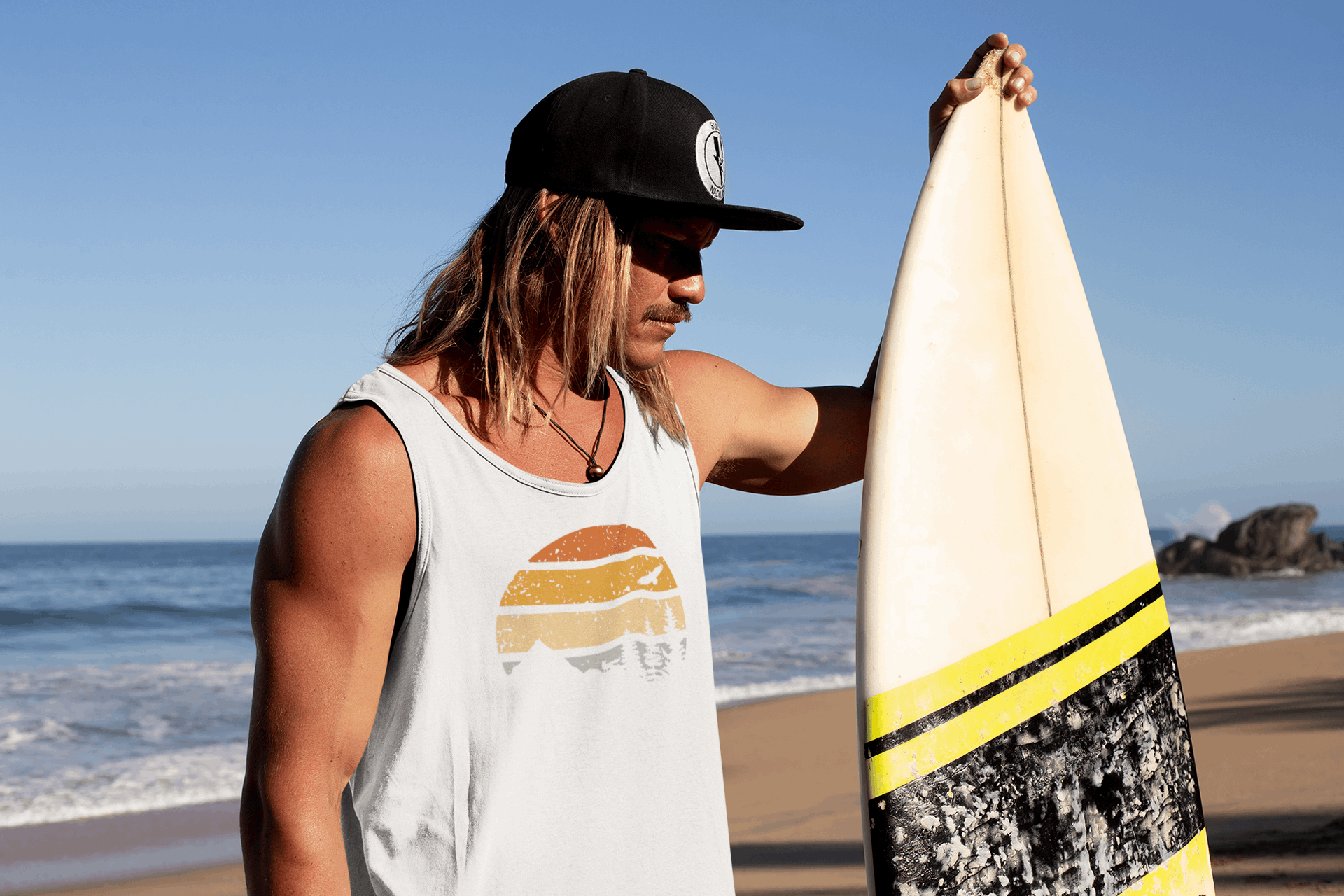 Men's white Madeira Vintage Tank Top with a retro sunset design. Organic cotton fabric, perfect for surf culture and outdoor adventures.