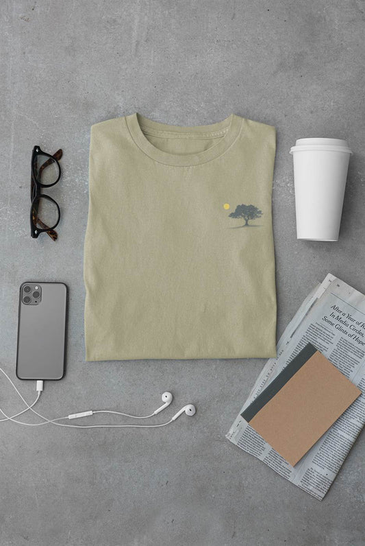 Minimalist unisex organic T-shirt in sage green featuring an oak tree and sunset design, inspired by Evora. Soft, sustainable cotton for everyday wear.