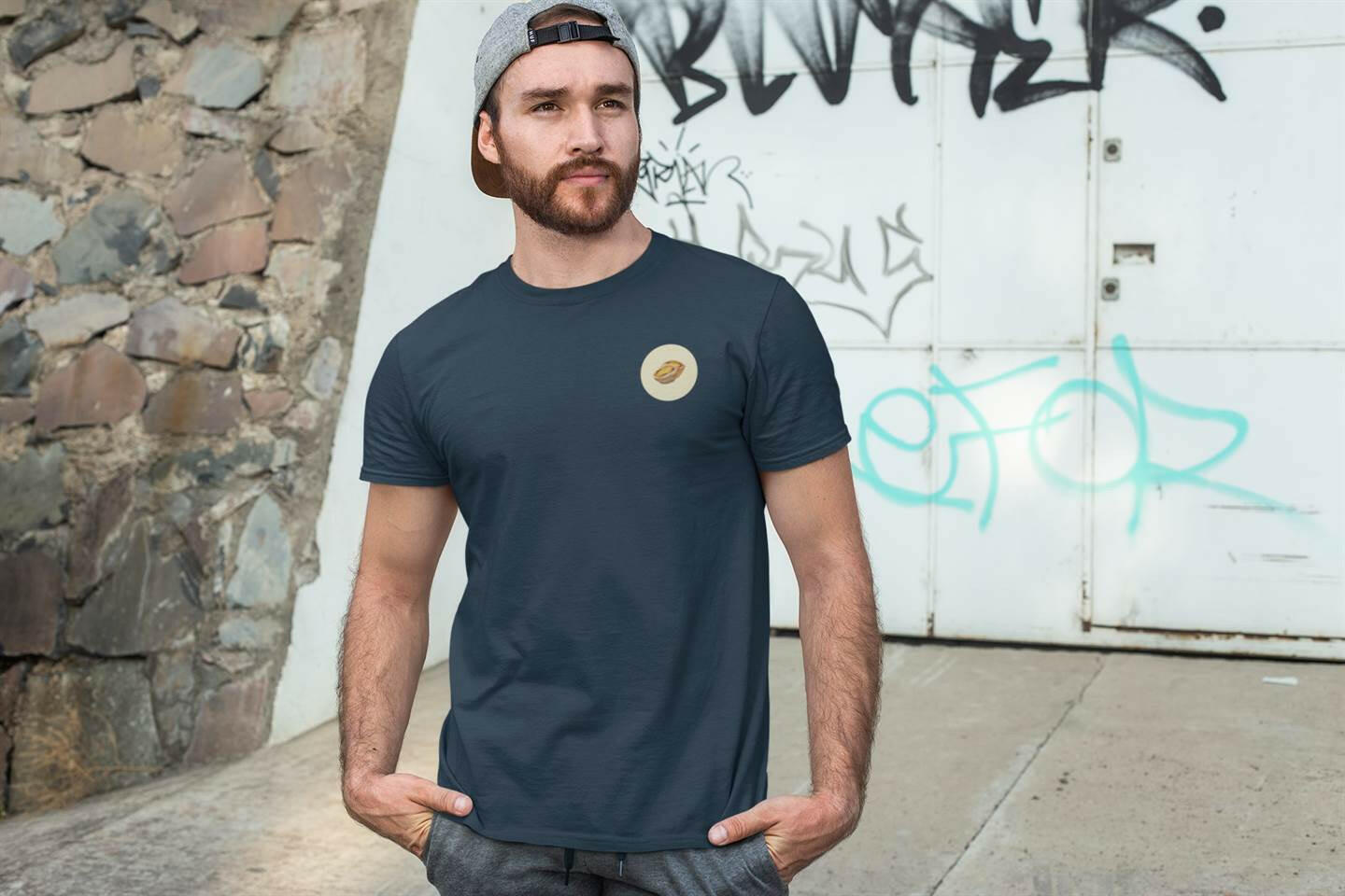Navy blue Pastel de Nata T-Shirt worn by a man in an urban setting. Organic cotton, minimalist Lisbon style.