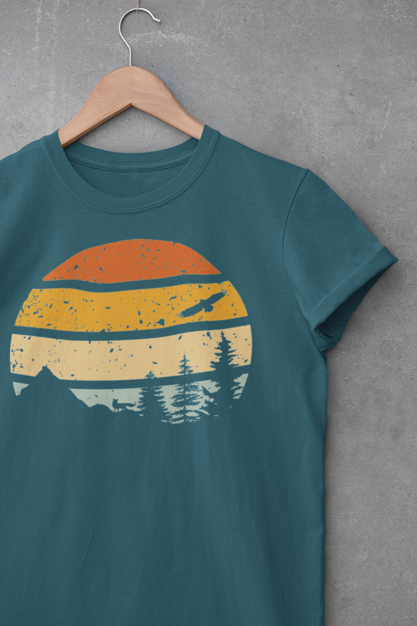 Madeira Mountains Retro Organic Vintage T-Shirt in teal with a distressed sunset and forest design. Perfect for hiking and outdoor enthusiasts.