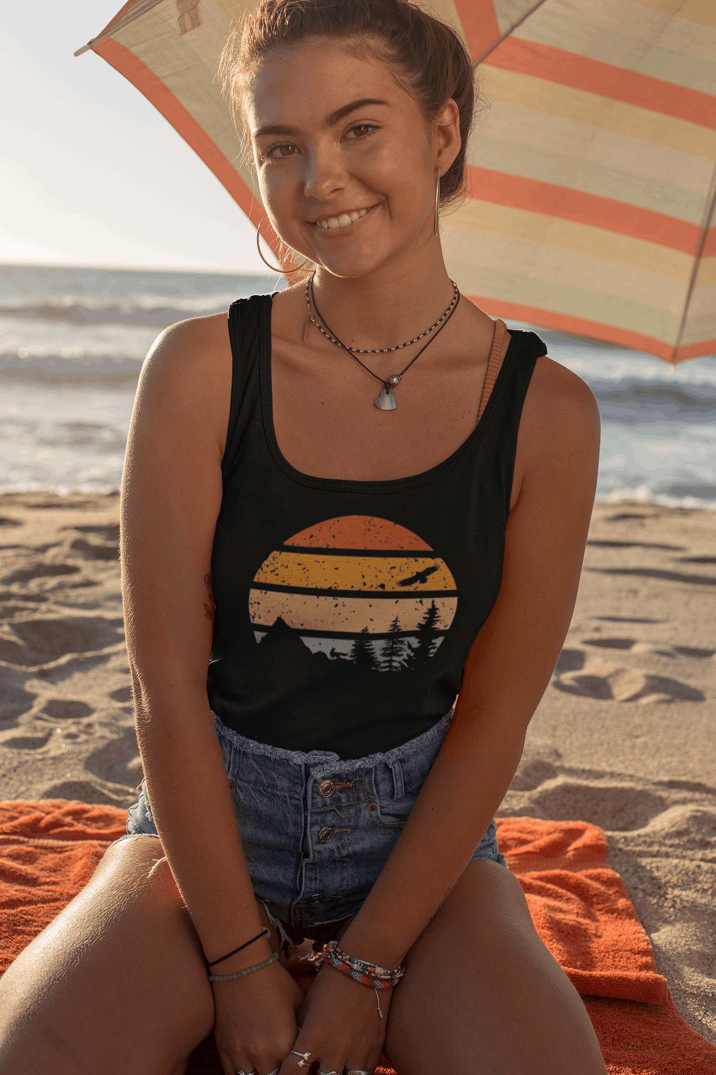Women's Madeira Vintage Tank Top in black with a retro sunset and mountain print. Soft organic cotton for a stylish and comfortable beach look.