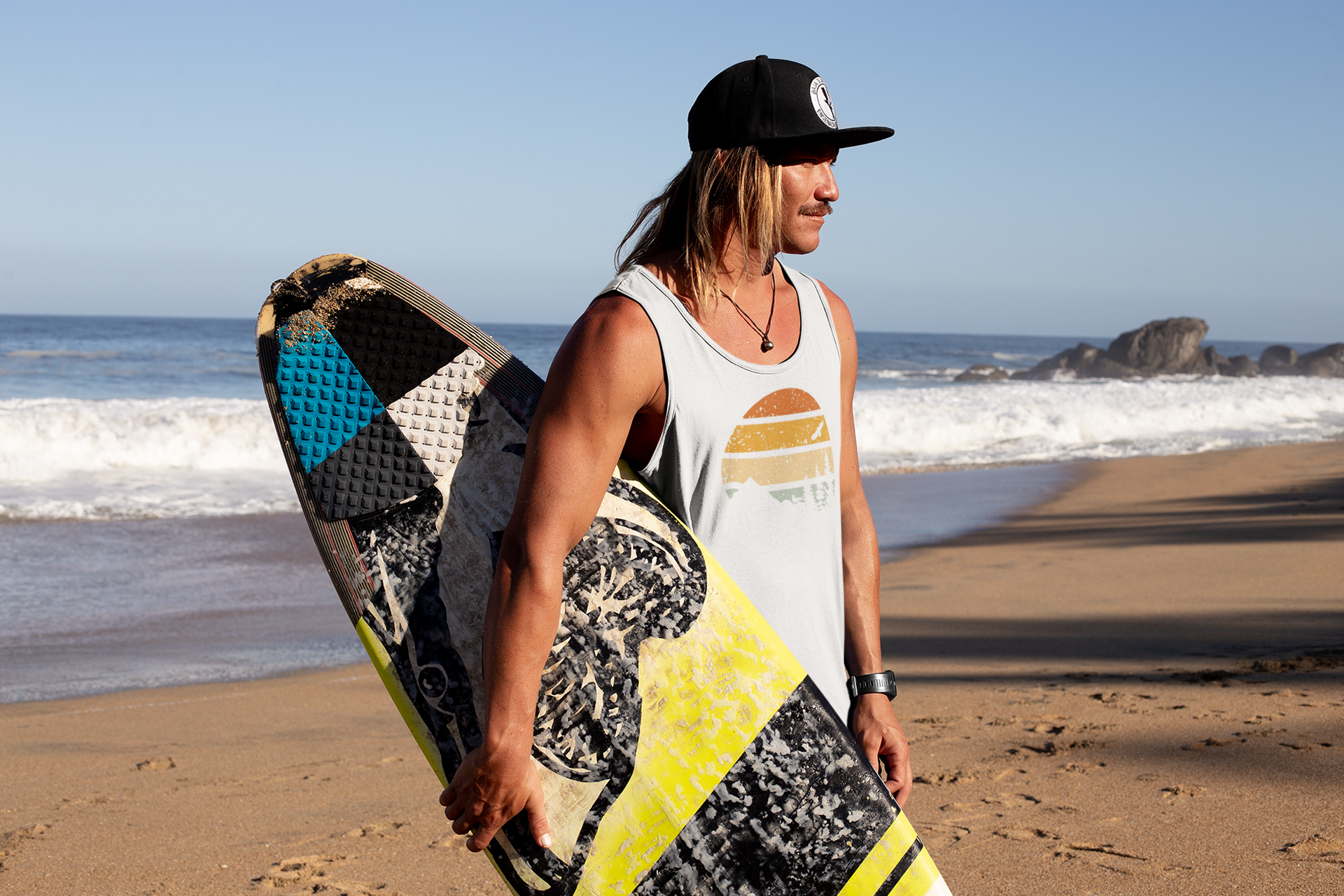 Men's white Madeira Vintage Tank Top with a retro sunset and mountain print. Organic cotton, perfect for surf and beach adventures.