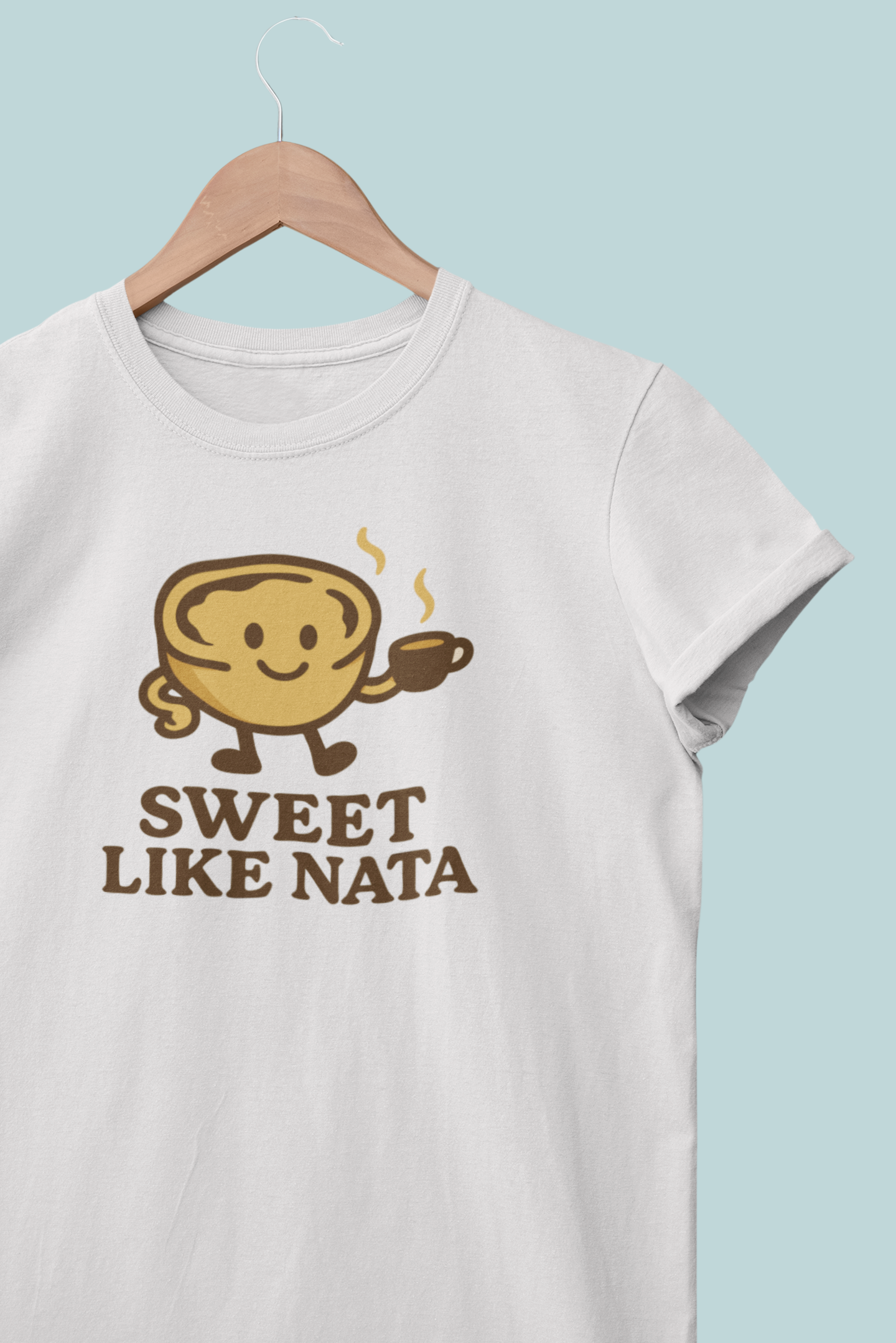 White t-shirt with a cartoon character and 'Sweet Like Nata' text on a light blue background