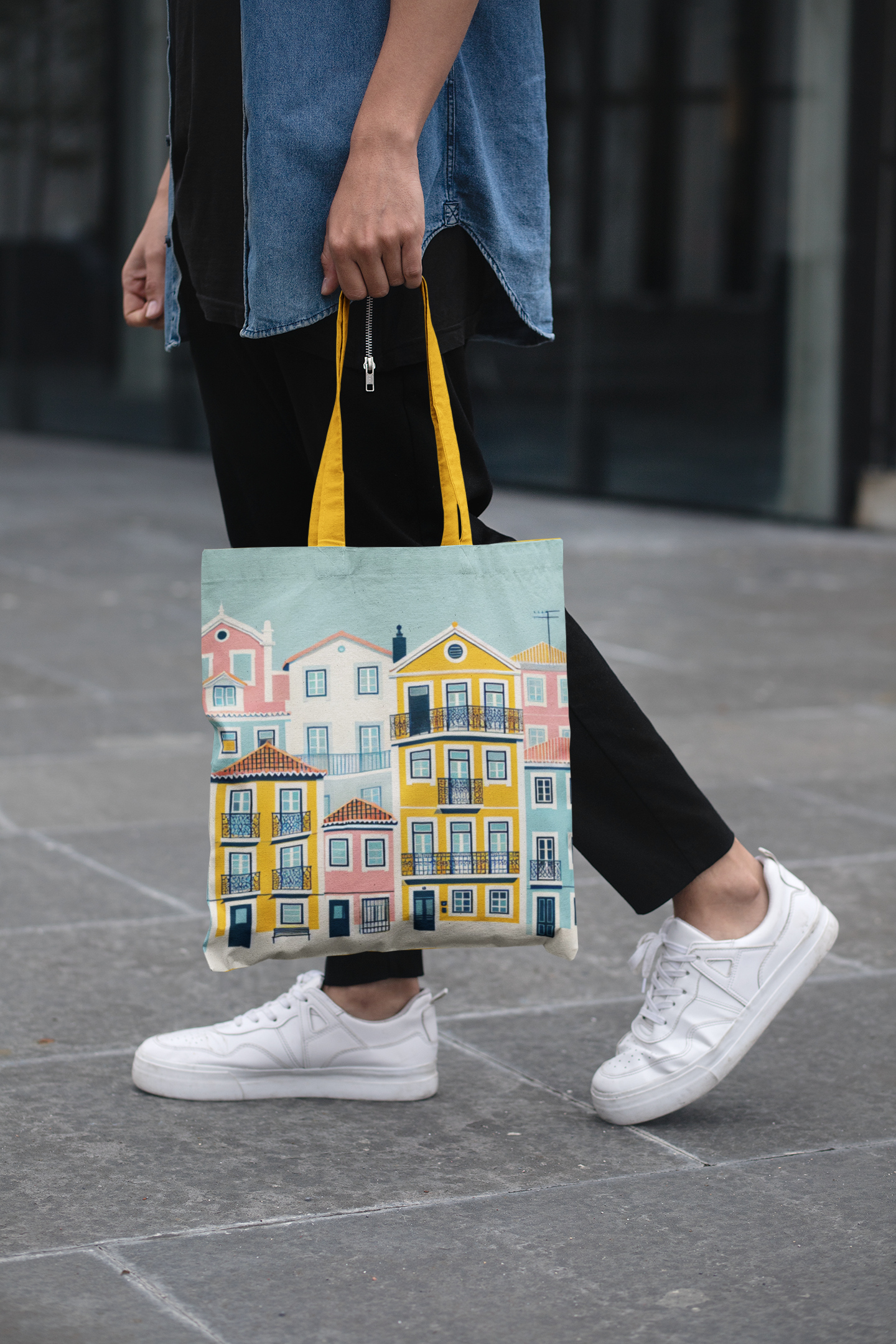 Person walking with the Lisbon Tote Bag from the Alfama Collection. A stylish and eco-friendly accessory with vibrant Portuguese designs.