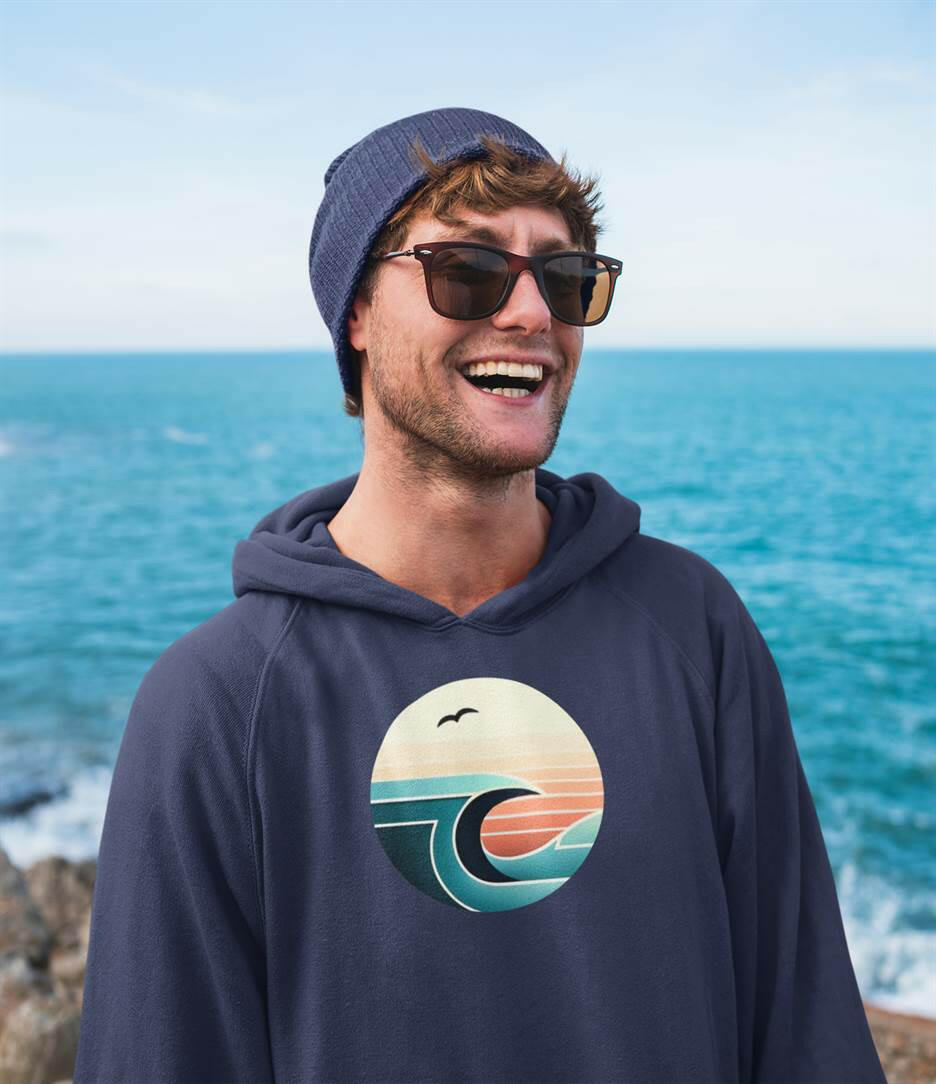 Nazaré Surf Wave Hoodie in navy blue with a vintage wave and seagull design. Organic cotton unisex hoodie for sustainable comfort and style.