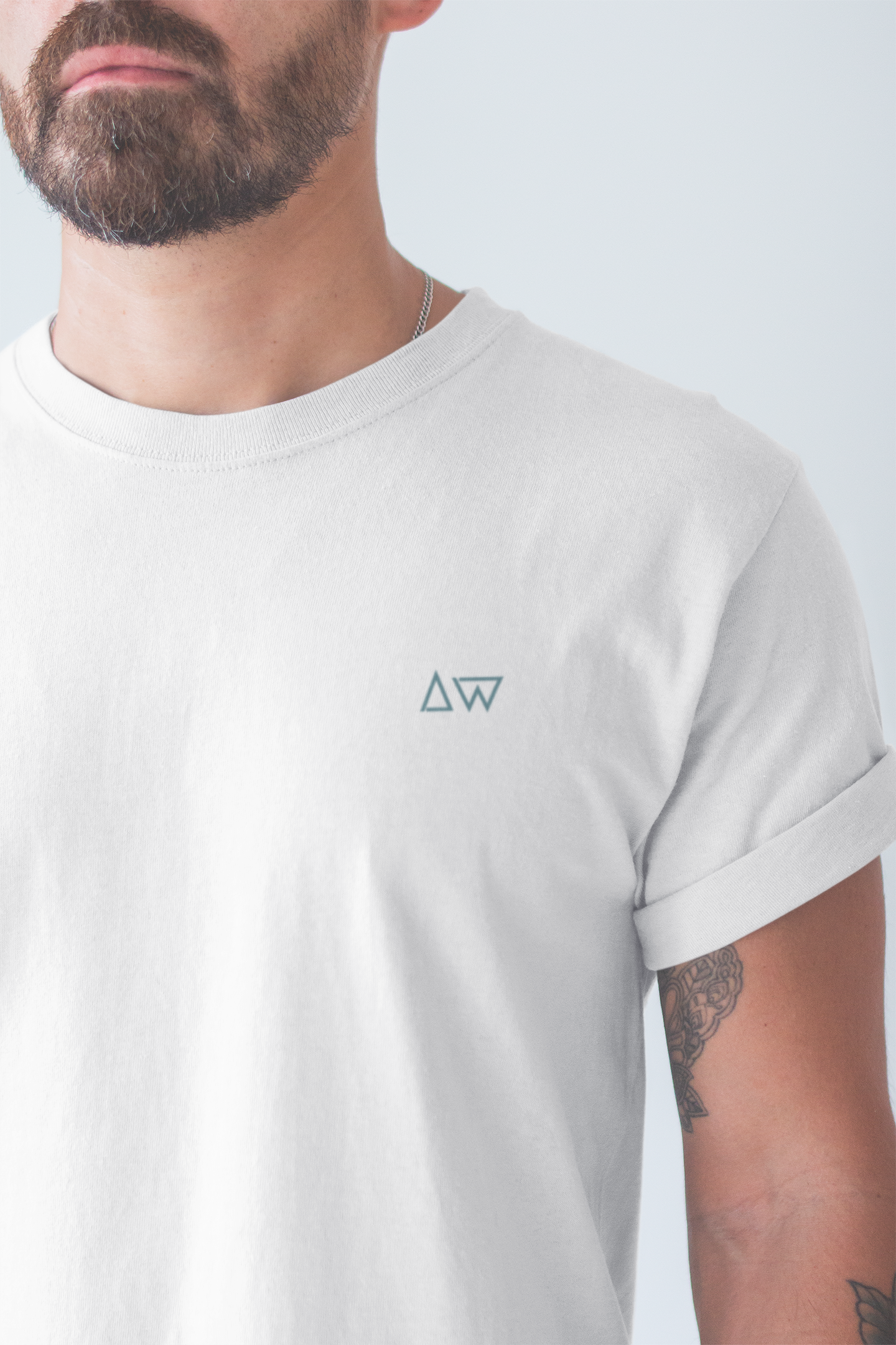 Model wearing the Ride the Waves T-Shirt, part of a surf collection.