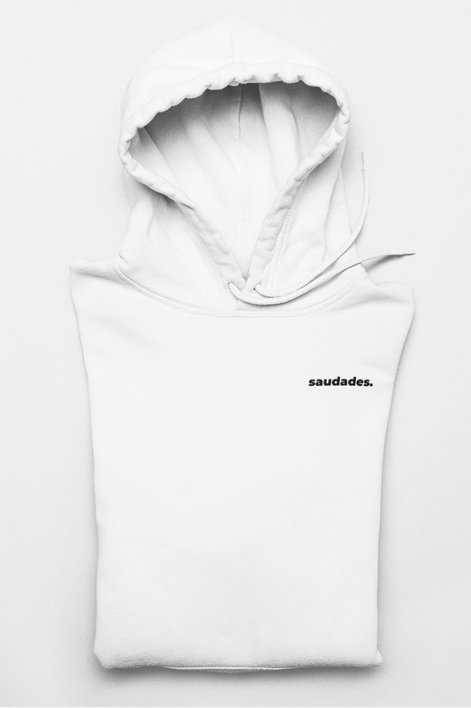 Saudade hoodie folded with logo tag and ready for packaging