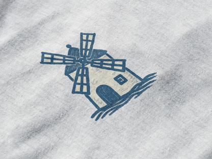 Atlantic Wave shirt with windmill logo.