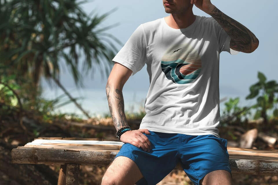White Nazaré Surf Wave organic t-shirt with a classic surf-inspired design. Soft, breathable, and eco-friendly for beach and casual wear.