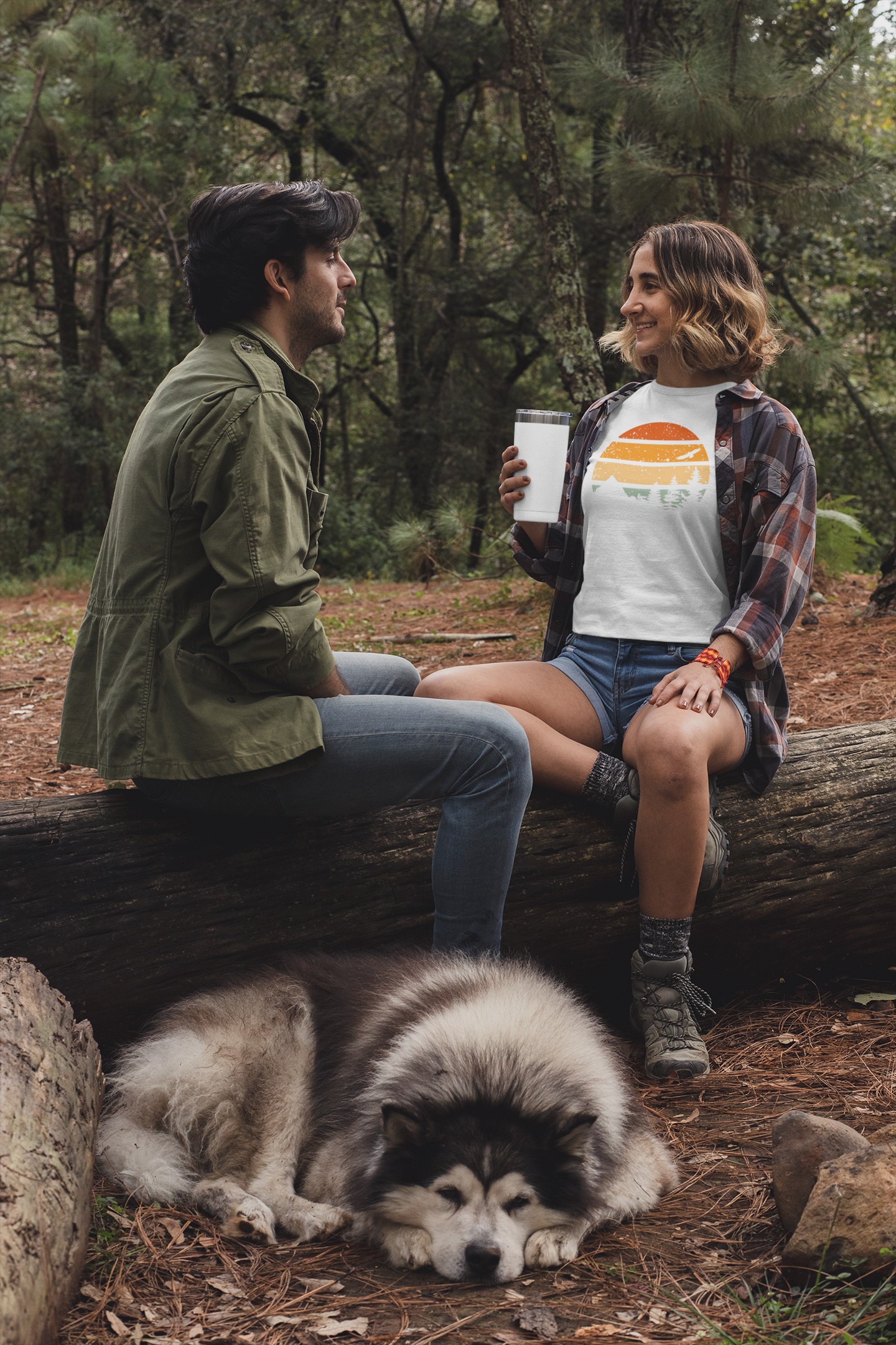 Woman wearing a white Madeira Mountains Retro Organic Vintage T-Shirt while camping. A stylish hiking tee for nature lovers.