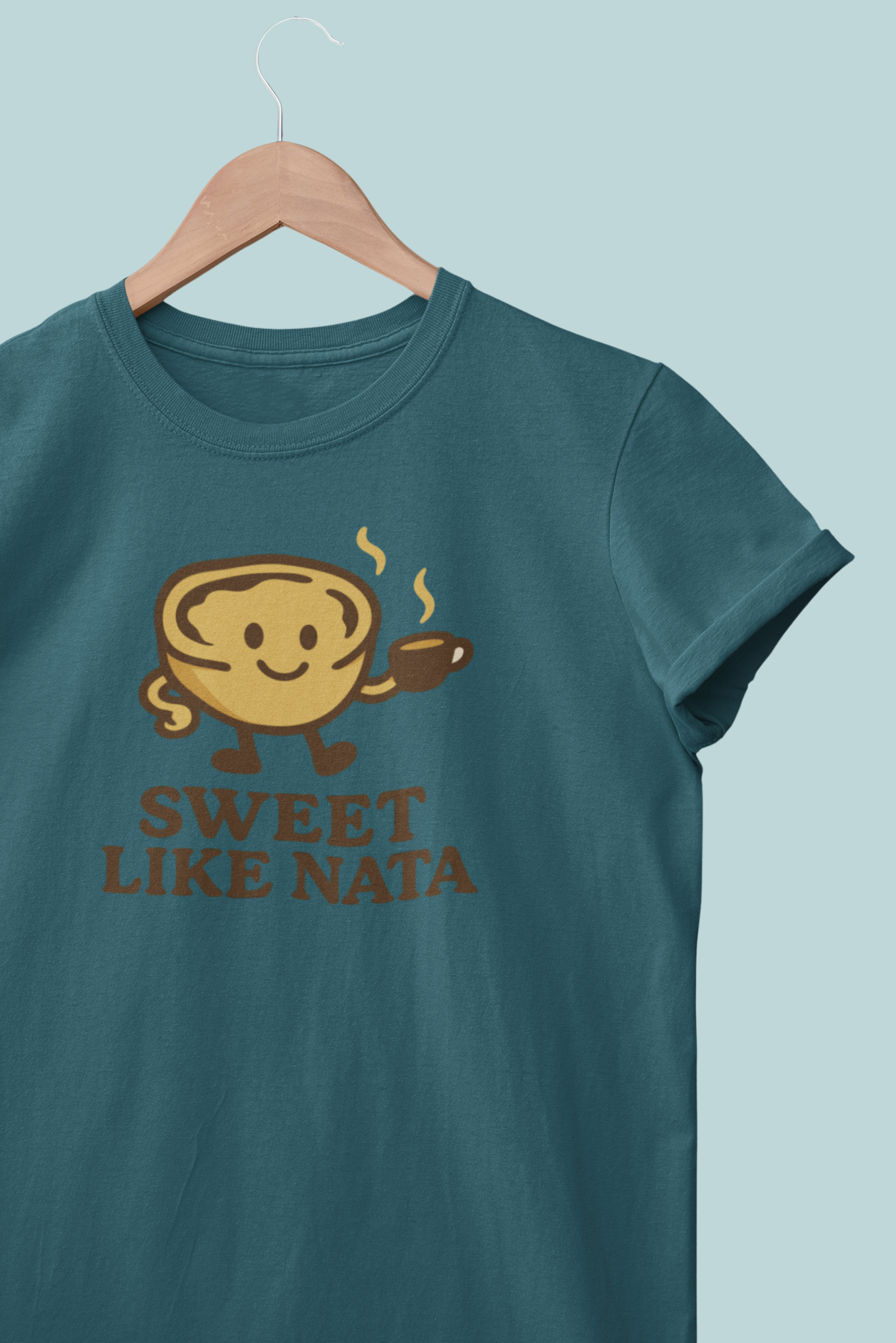 Close-up of cute Portuguese pastry logo on organic cotton shirt.