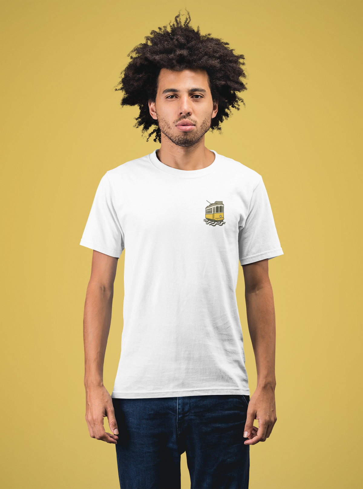 Person wearing a white t-shirt with a logo on a yellow background