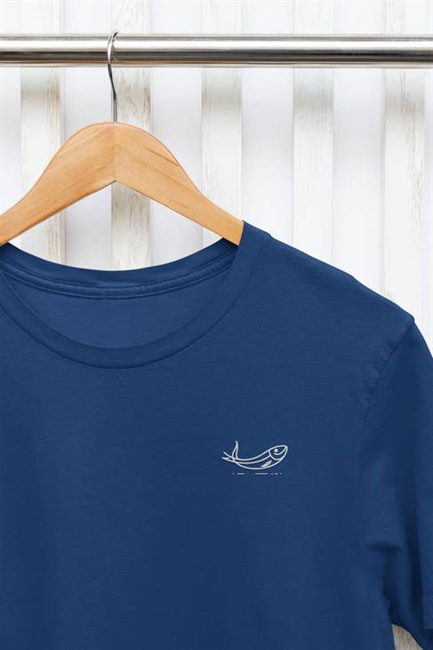 Navy blue sardine t-shirt with minimalist embroidery, hanging on a wooden hanger. Made from organic cotton for a comfortable and eco-conscious fit.