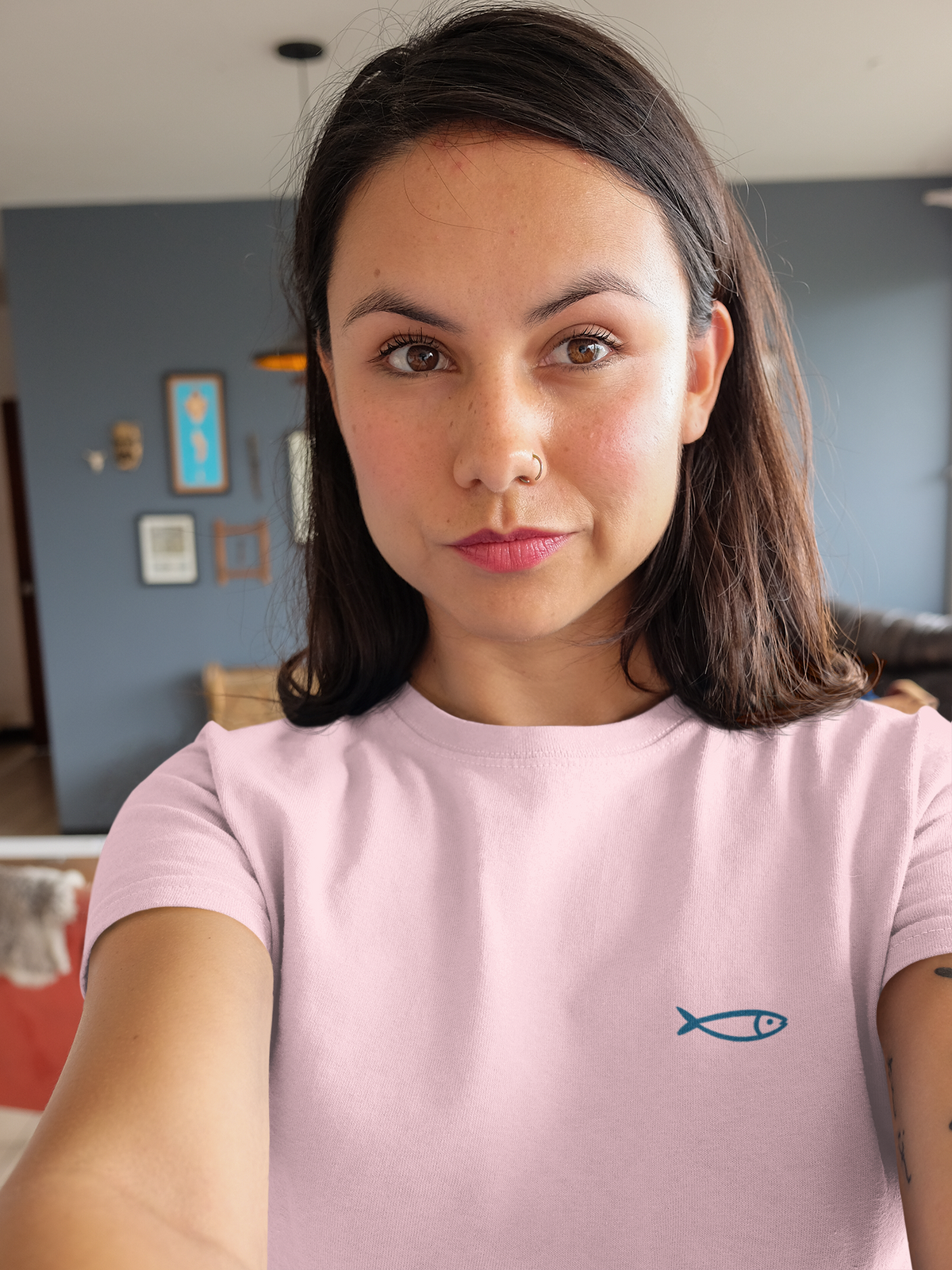 Folded eco-friendly t-shirt featuring sardine logo.