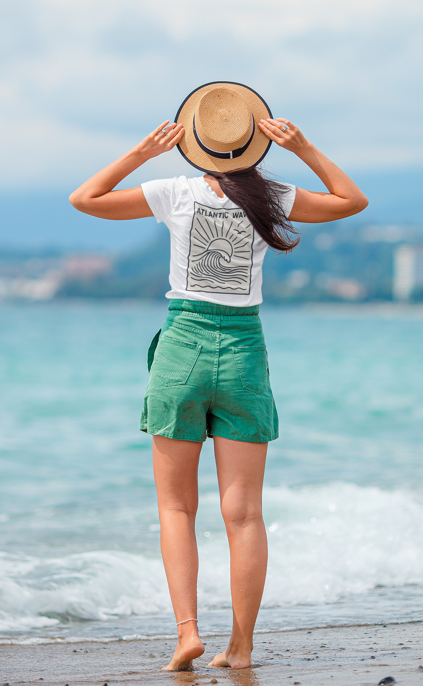 Close-up of minimal surfboard logo printed on the back of the shirt.