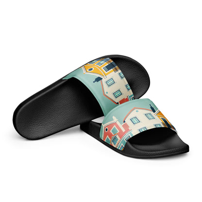 Side view of Alfama Woman Pool Slippers with a vibrant Portuguese house design on a black sole. Durable and stylish for casual outings.